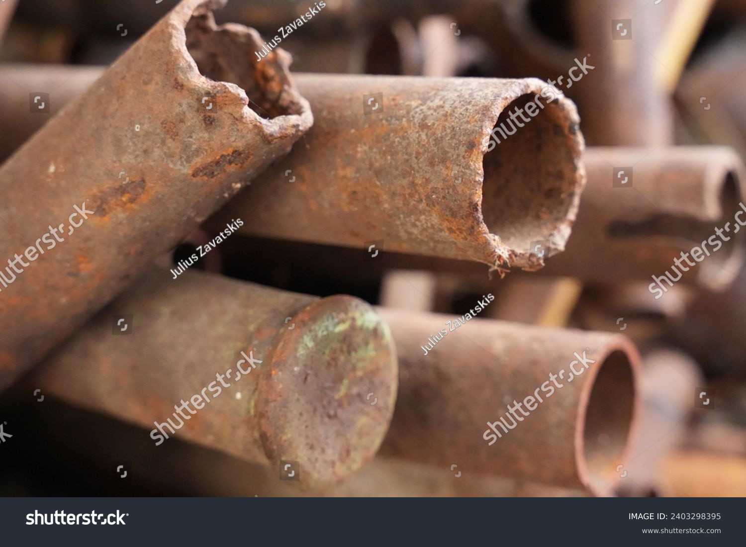 Rough cut old rusty pipes #2403298395