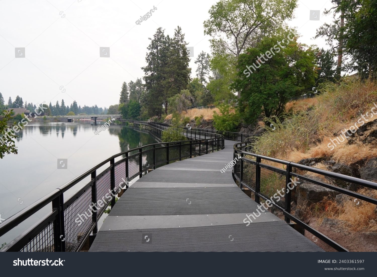 Walking path along the Deschutes River at Drake Park in Bend, Oregon #2403361597