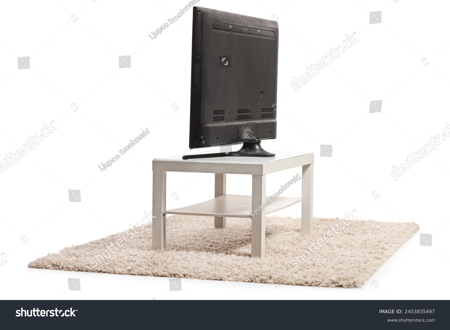Rear view shot of a tv on a white table isolated on white background #2403835497