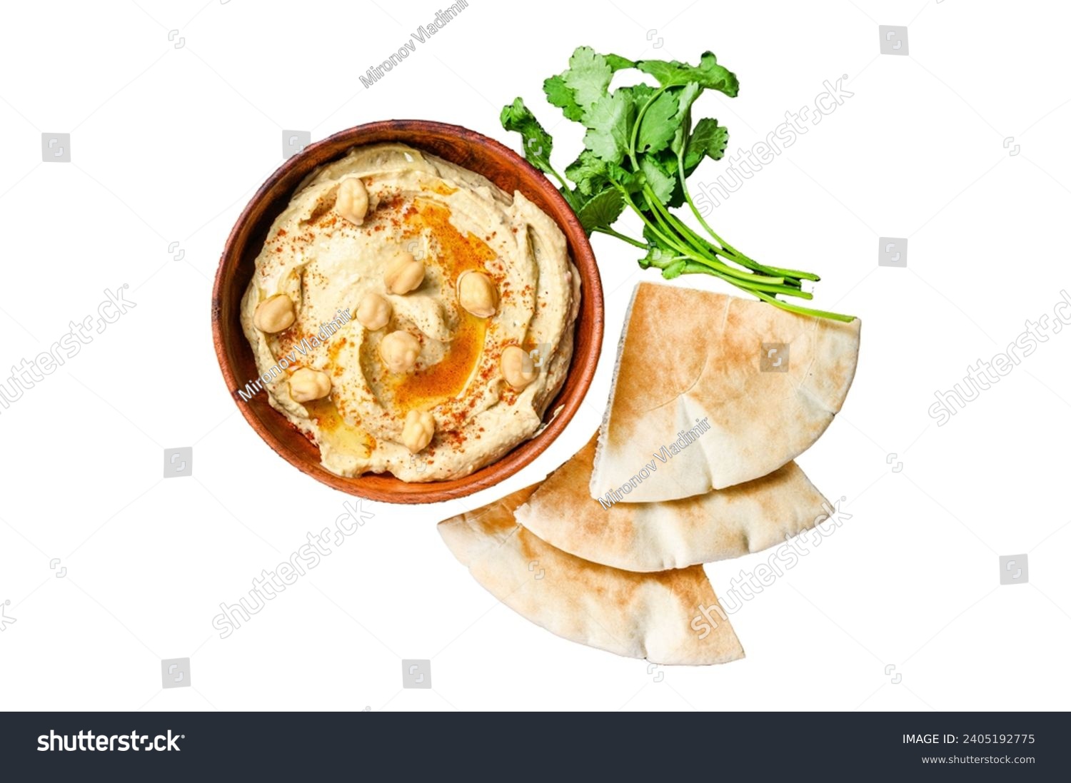 Hummus paste with pita bread, chickpea and parsley in a wooden bowl. Isolated on white background, top view #2405192775