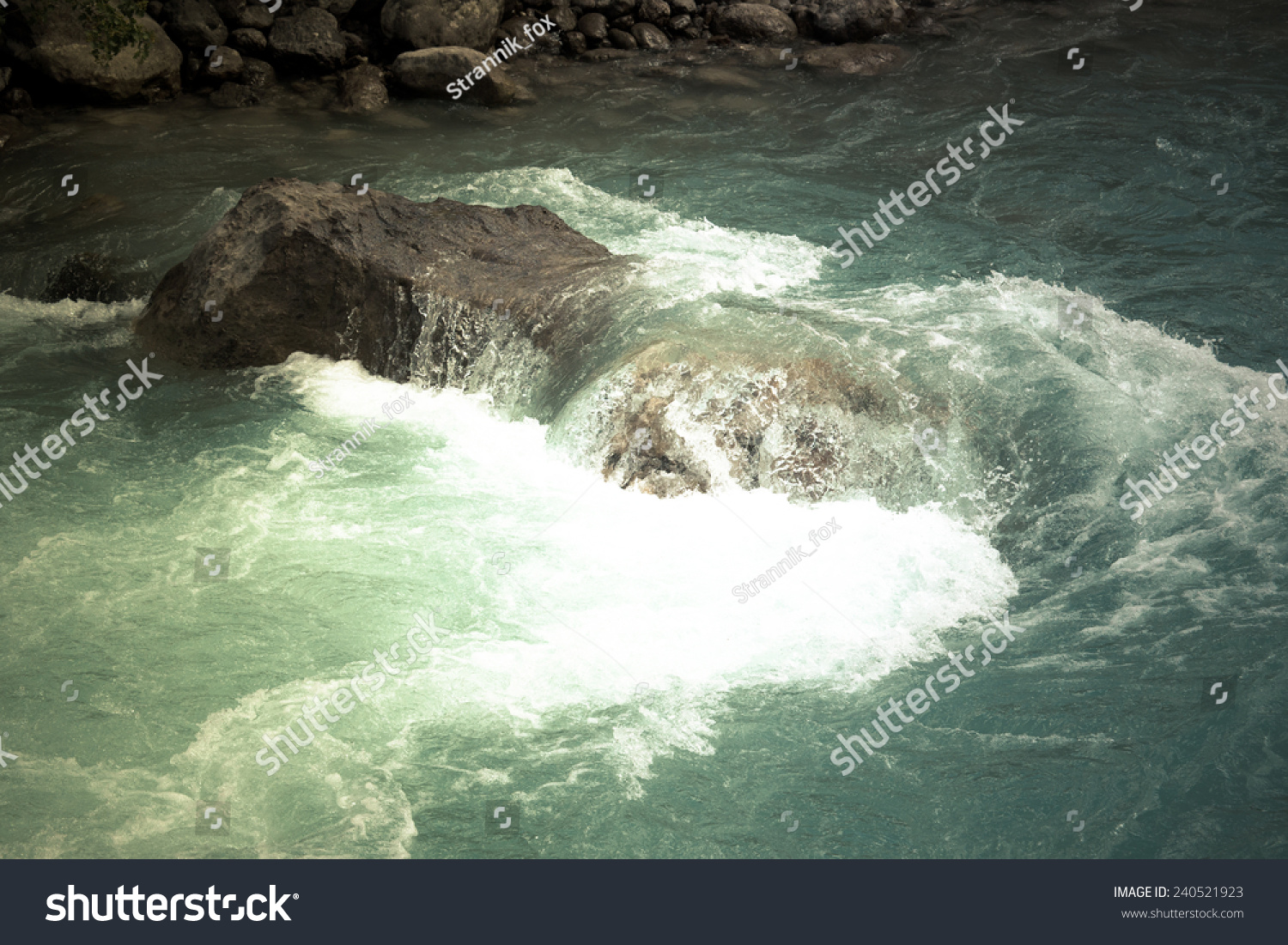 green water of the mountain river and a large stone #240521923