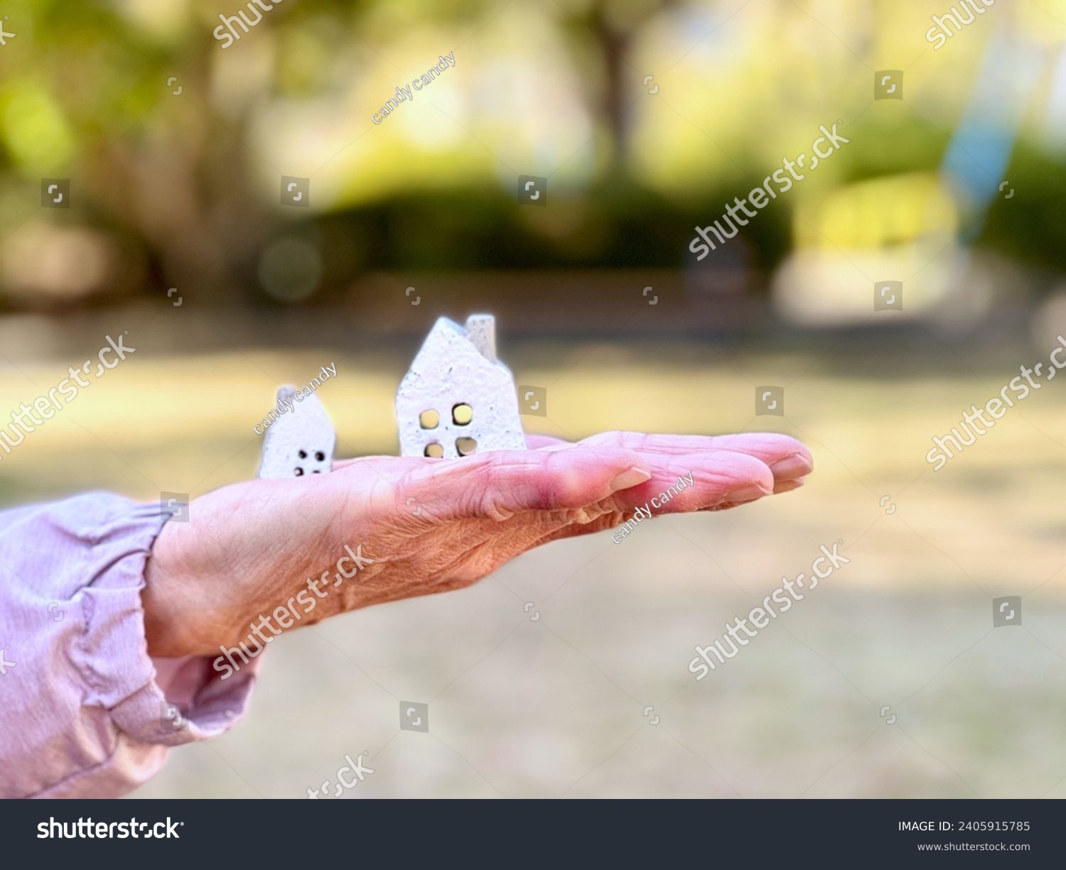 Elderly woman carrying two household items #2405915785