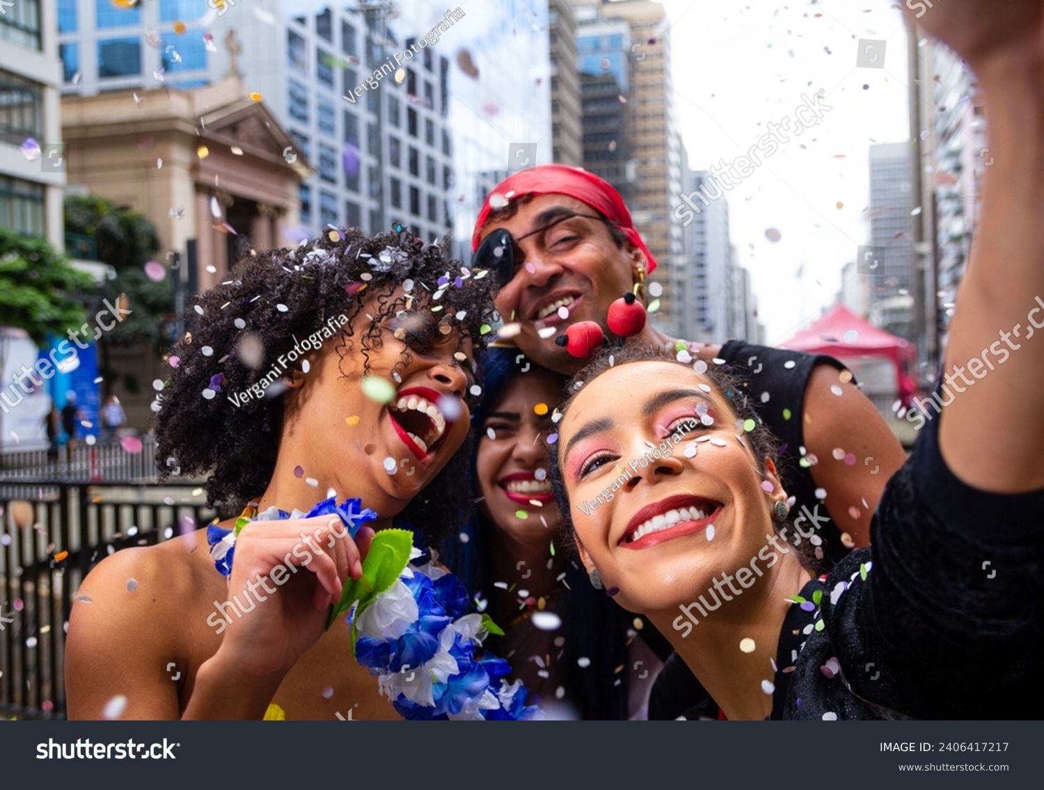 Girls taking selfie at street party parade, brazilian carnaval. Group of Brazilian friends in costume celebrating. #2406417217