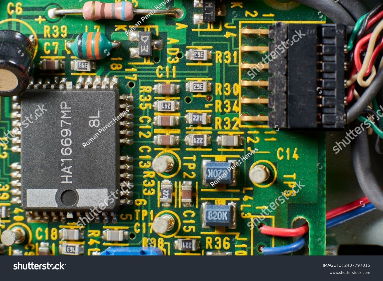 Detail of old electronic components of a motherboard with its chips, capacitors and solders #2407797015