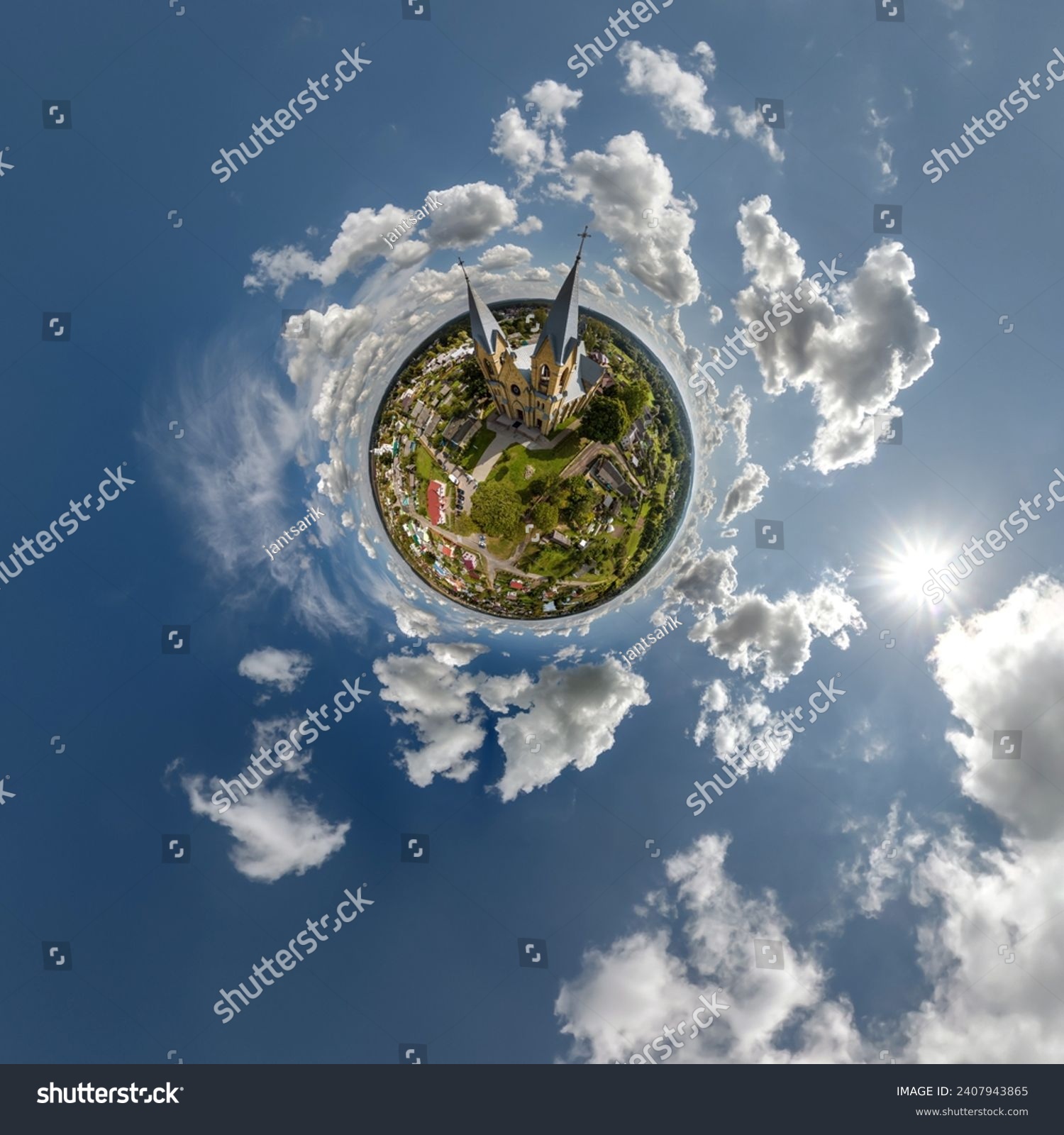 little planet transformation of spherical panorama 360 degrees overlooking church in center of globe in blue sky. Spherical abstract aerial view with curvature of space. #2407943865