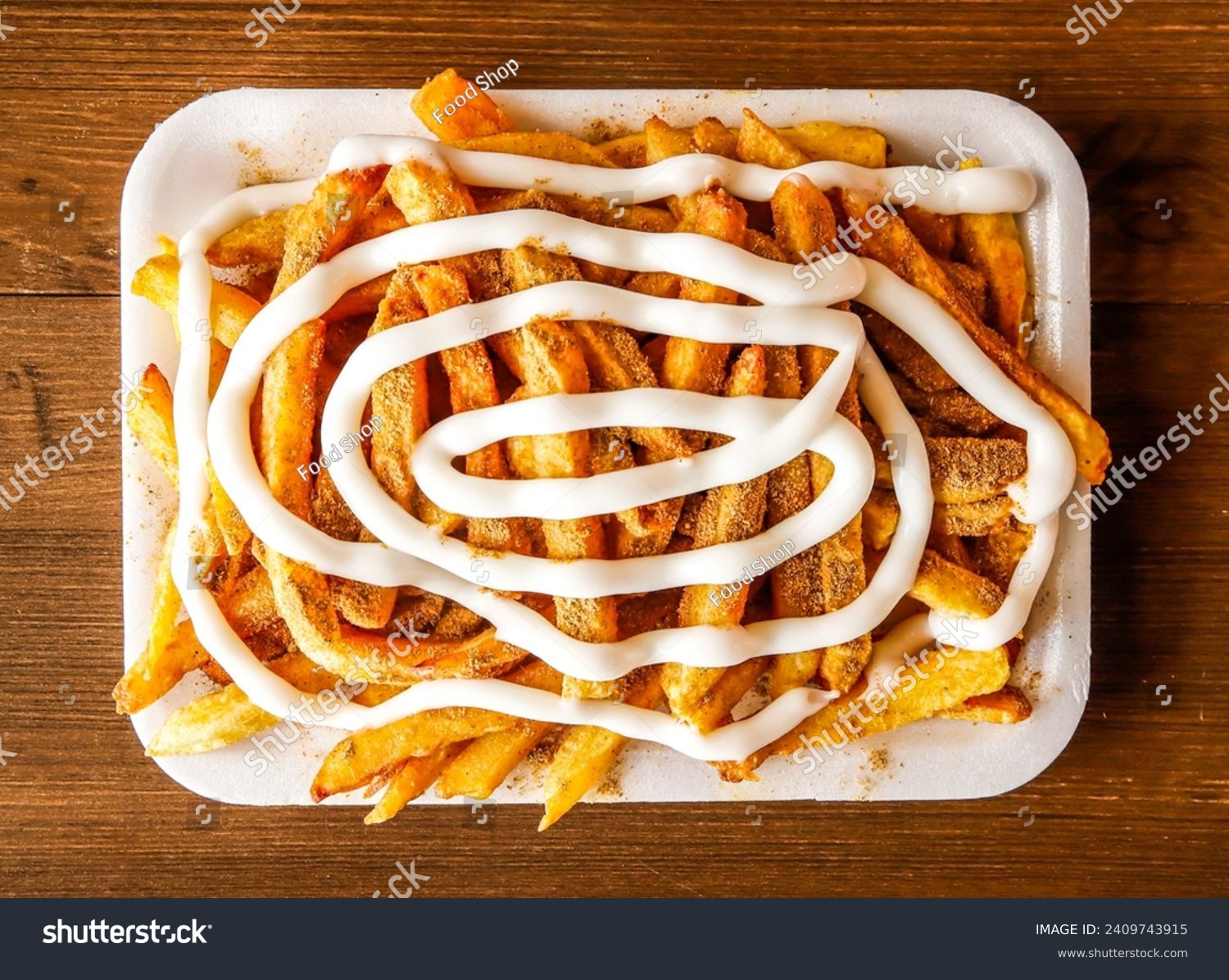 Mayo fries with masala or potato chips loaded with mayonnaise served in dish isolated on wooden background top view of indian spices and pakistani food #2409743915