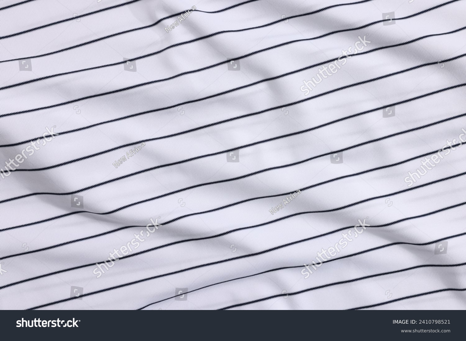 Striped baseball uniform as background, top view #2410798521