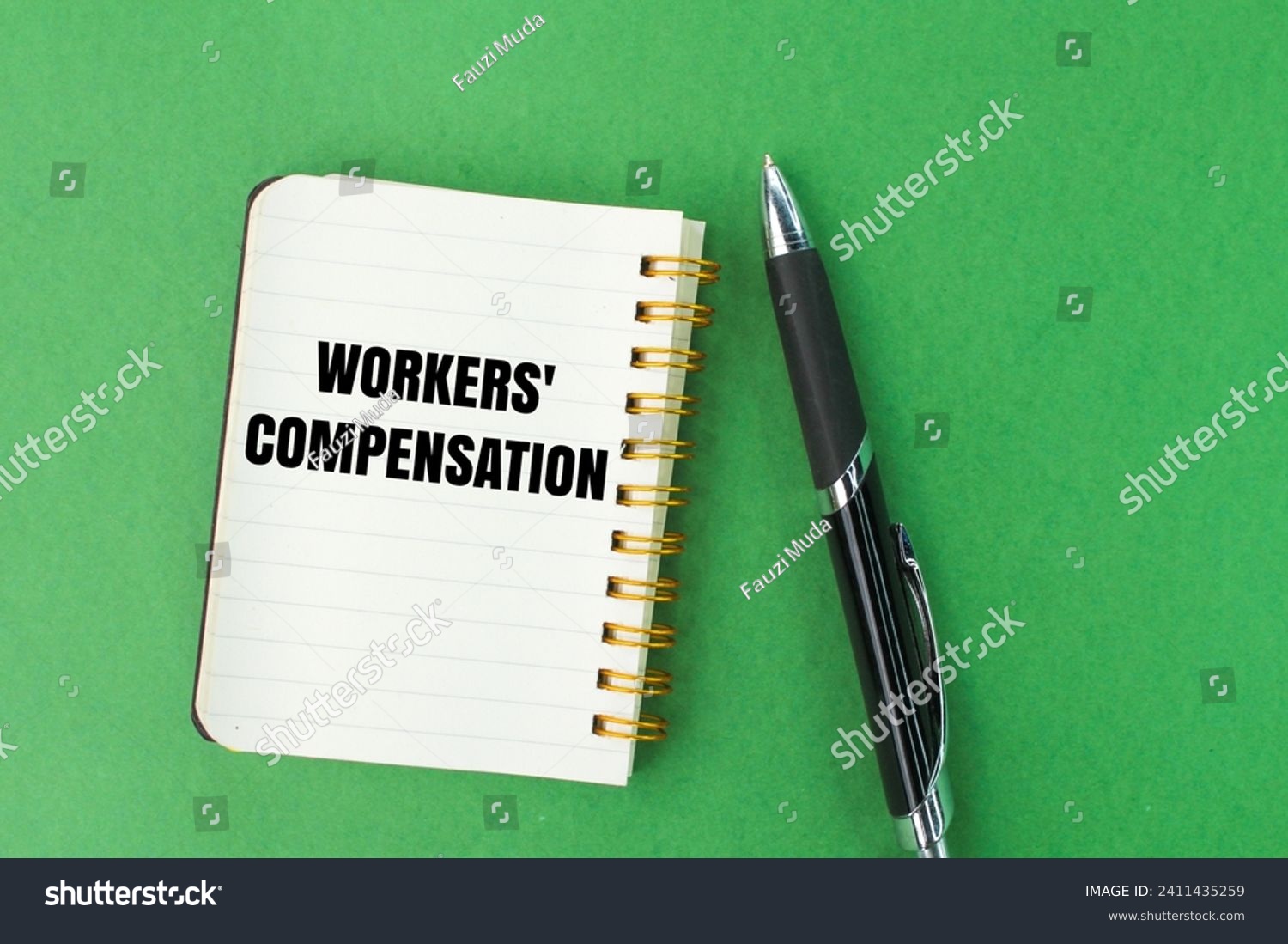 pen and notebook with the words workers' compensation #2411435259