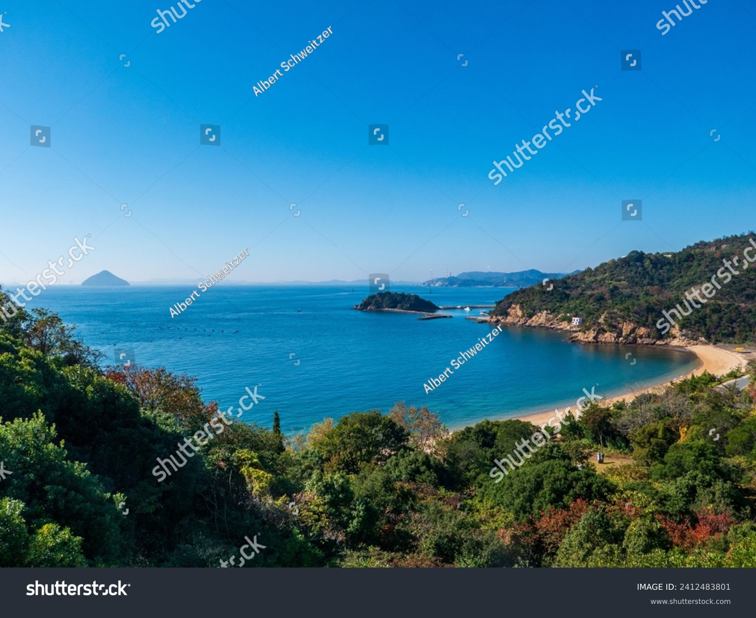 Panoramic view over the coastline with beach of Naoshima Island in the Seto Inland Sea in Japan, known for its museums of contemporary art, architecture and sculpture #2412483801