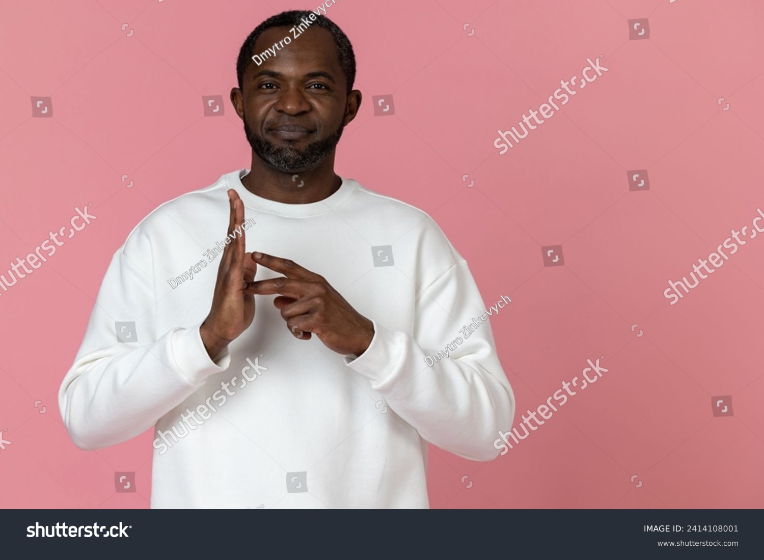 Deaf mute black man wearing white sweatshirt gesturing sign language #2414108001