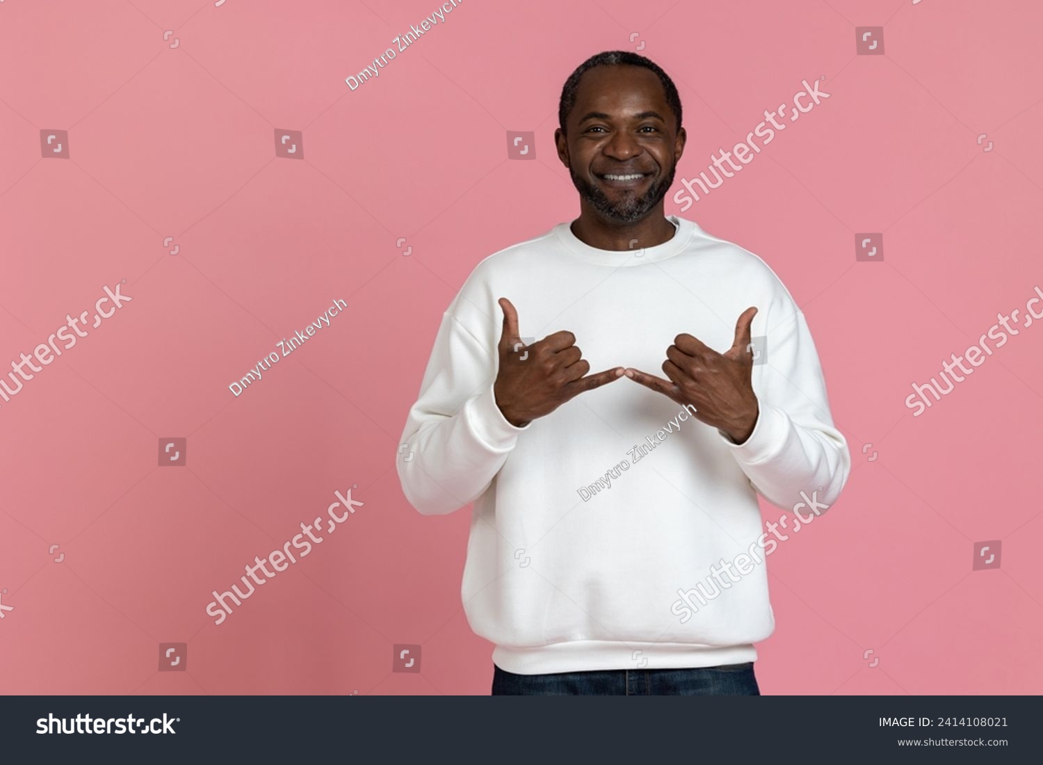 Black man wearing white sweatshirt using sign language #2414108021