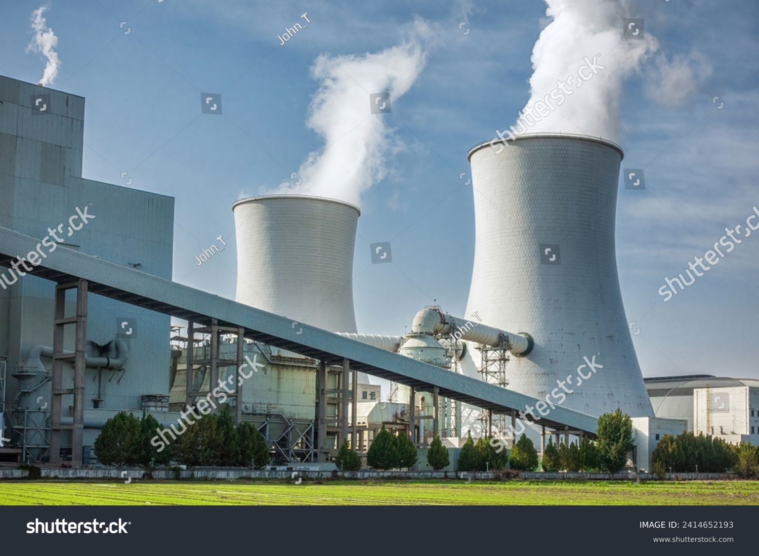 Industrial Cooling Towers Emitting Steam at Power Plant #2414652193