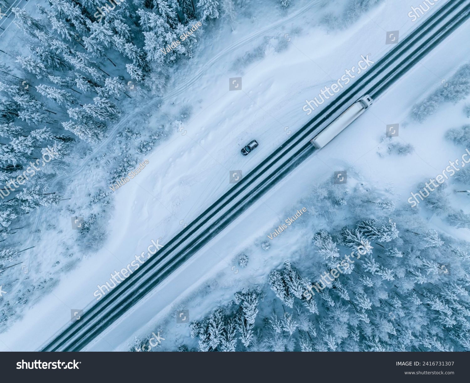 Aerial view of beautiful winter landscape and road in Lapland during sunset. #2416731307