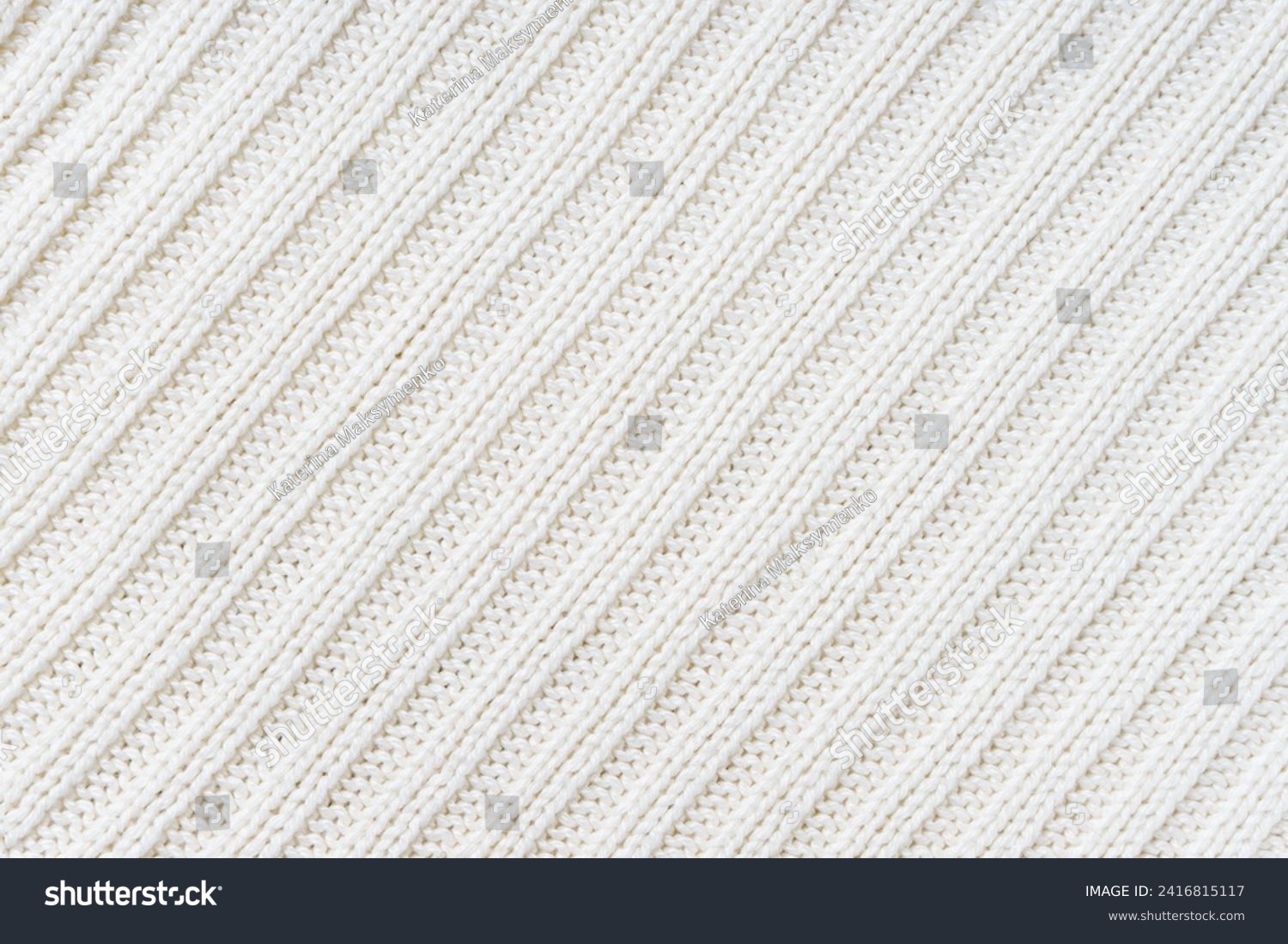 Jersey textile background , white diagonal striped knitted fabric. Woolen knitwear, sweater, pullover surface texture, textile structure, cloth surface, weaving of knitwear material #2416815117