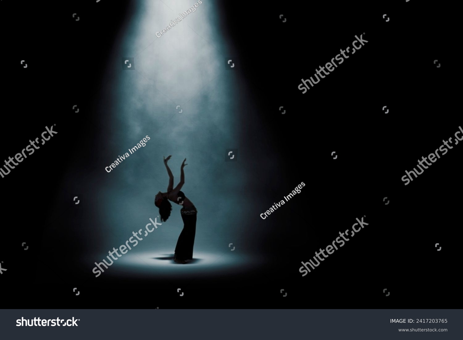 Side view silhouette of beautiful woman doing belly dance #2417203765
