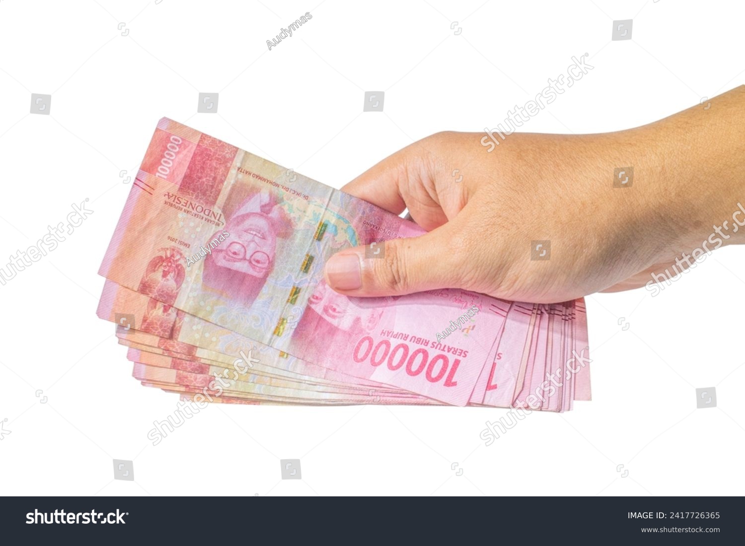 Hand Holding Indonesian Rupiah Isolated On White Background, Hand Holding Money Isolated On White Background #2417726365
