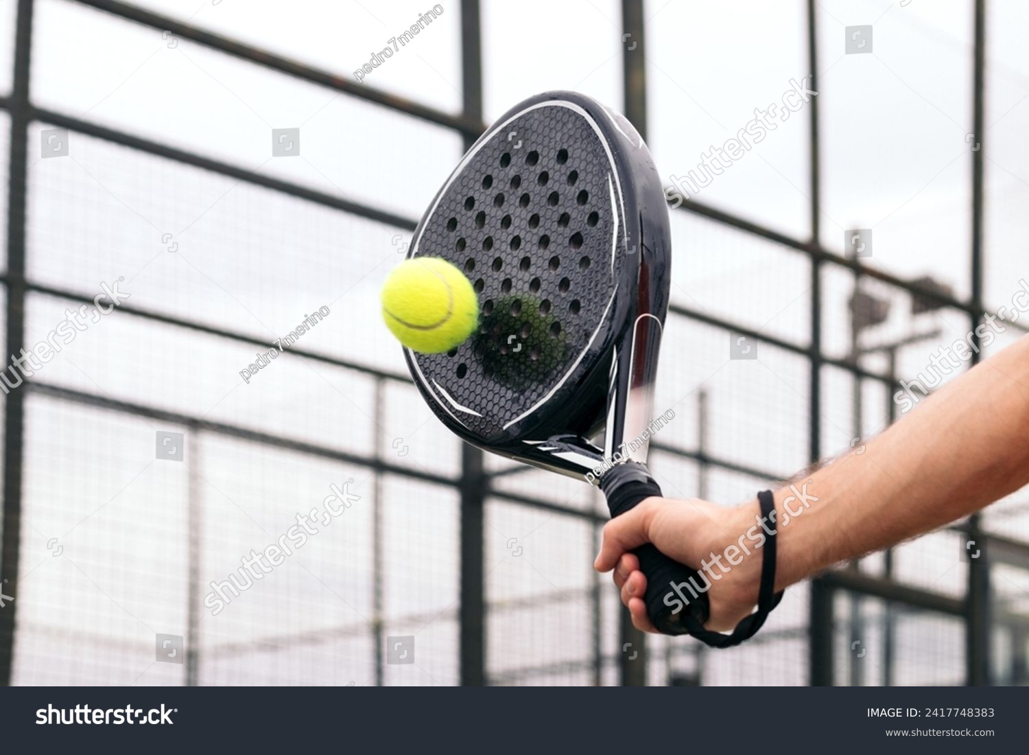 paddle tennis racket hitting ball. close- up on the racket #2417748383