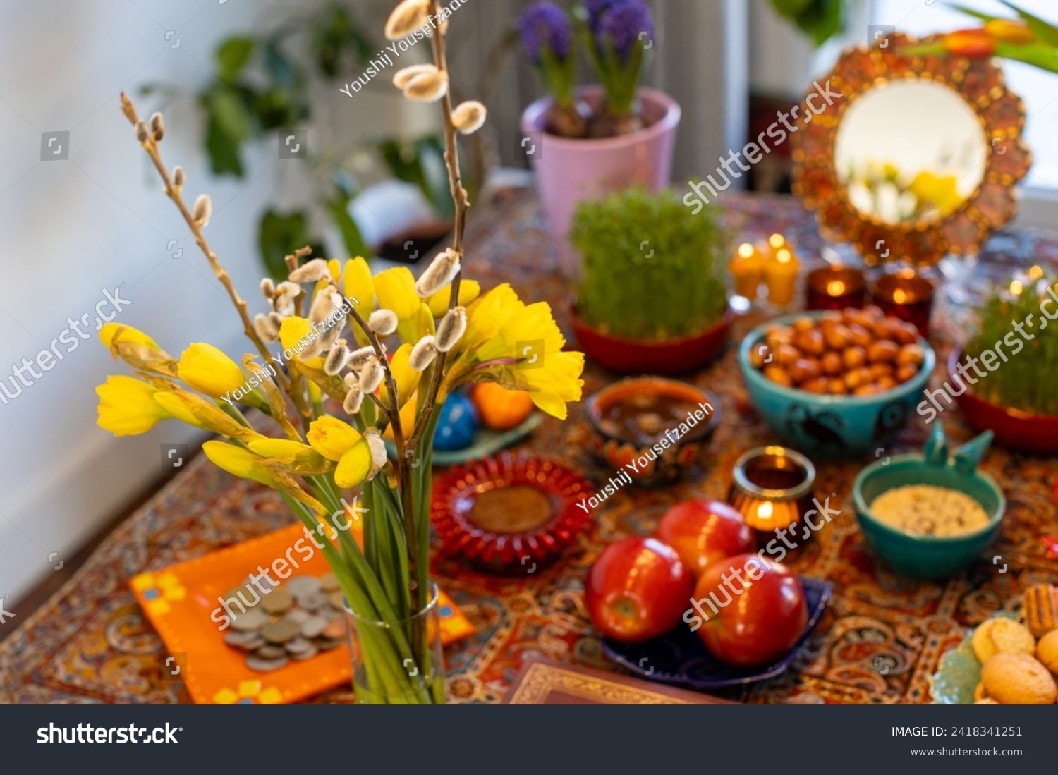 Haft Seen traditional table of Nowruz. Haft-Seen also spelled as Haft Sin is a tabletop (sofreh) arrangement of seven symbolic items traditionally displayed at Nowruz, the Iranian new year. #2418341251