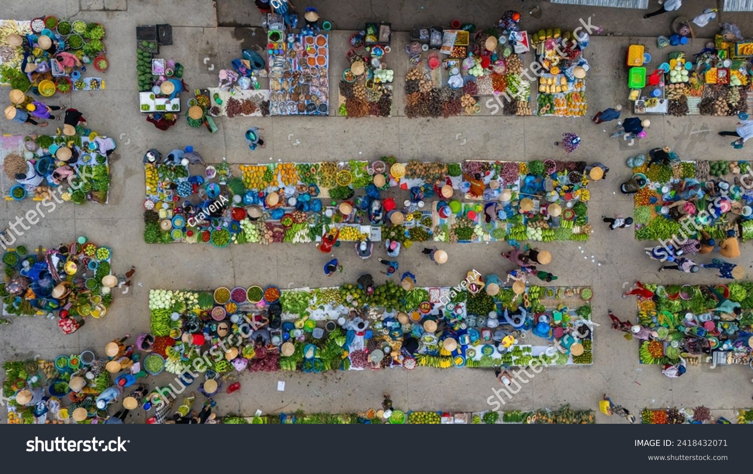 Aerial view of busy local daily life of the morning local market in Vi Thanh or Chom Hom market, Vietnam. People can seen exploring around the market. #2418432071