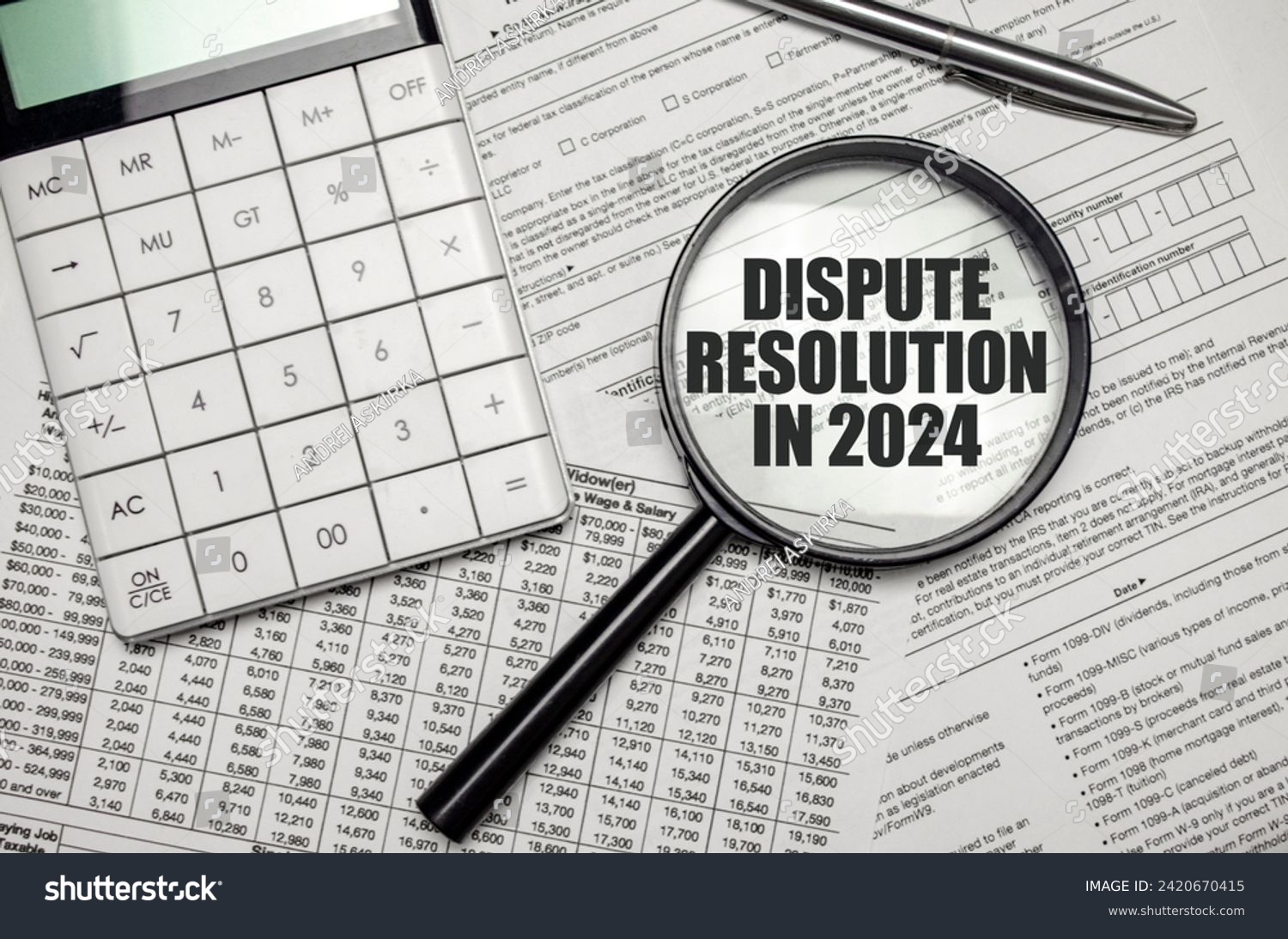 DISPUTE RESOLUTION IN 2024 word on magnifying glass with calculator and documents #2420670415