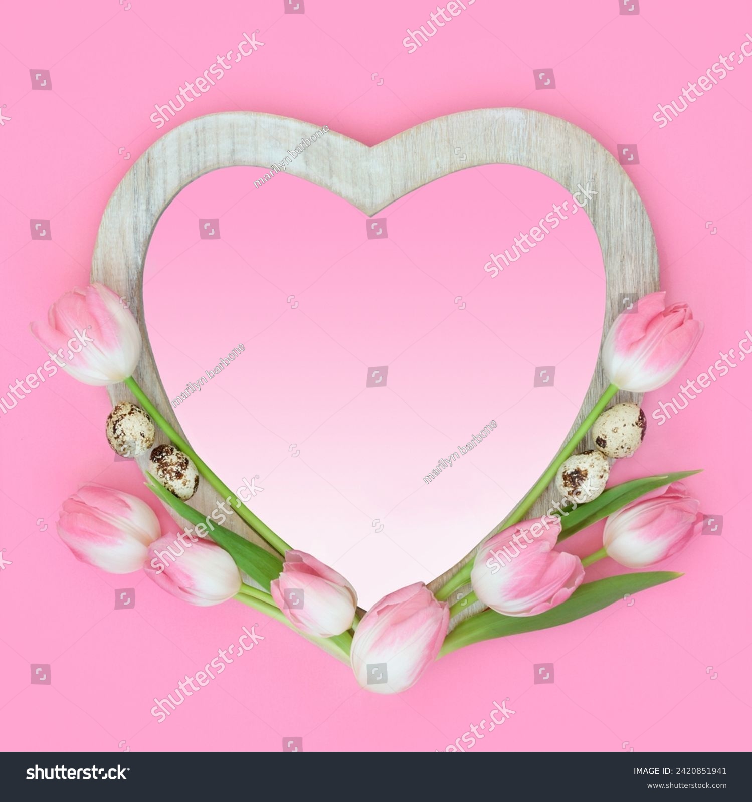 Tulip flower and quail egg abstract heart shape frame with gradient insert. Spring and Easter minimal floral nature food design on pastel pink background. #2420851941