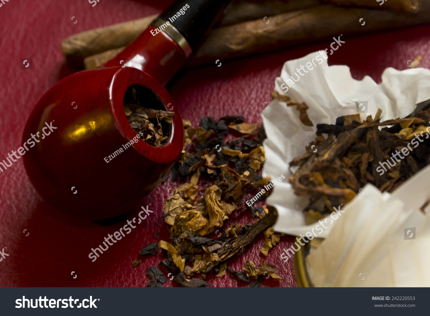 Pipe, tobacco, cigarettes, cigars, smoking, etc. on red leather background  #242220553