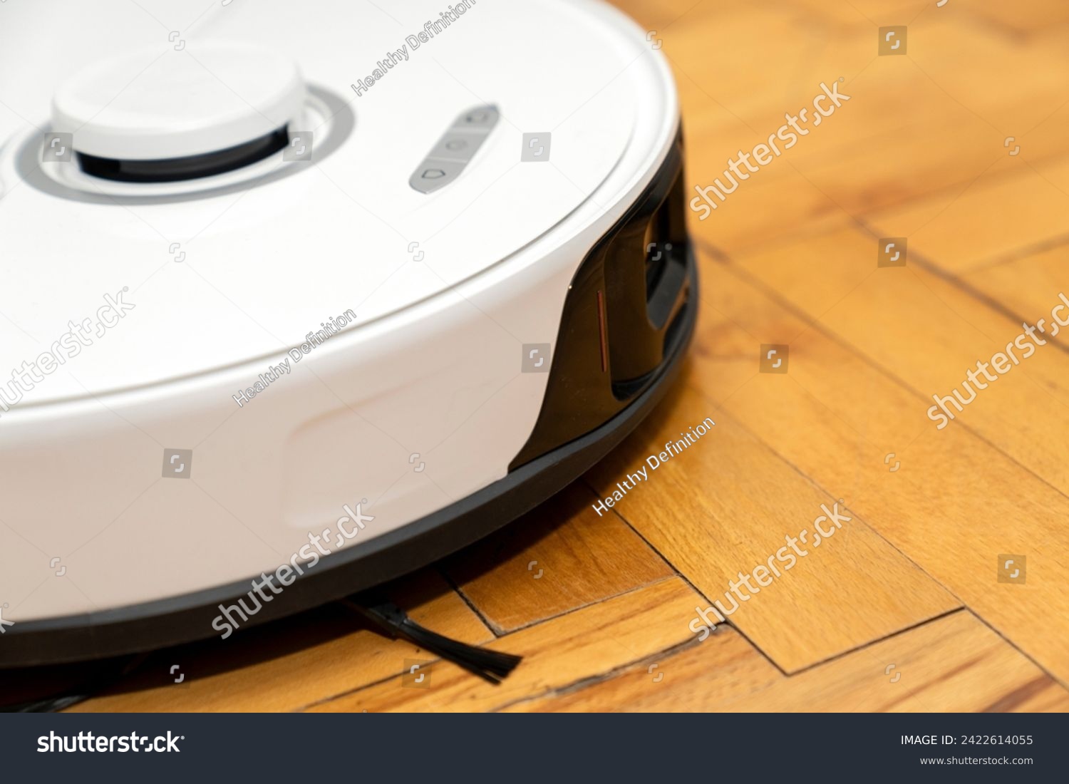 robot vacuum cleaner in modern smart home, robotic vacuum cleaner on wooden or laminate or parquet floor, cleaning dust on tile floors. Modern smart cleaning technology housekeeping. #2422614055