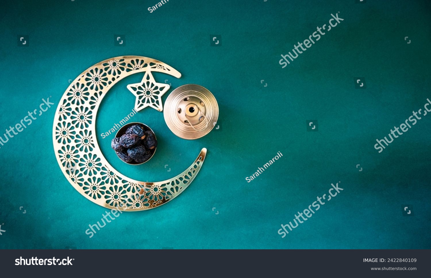 Ramadan Mubarak background 2024, Banner type image of crescent moon shape with dates isolated on dark green colour background with copy space #2422840109