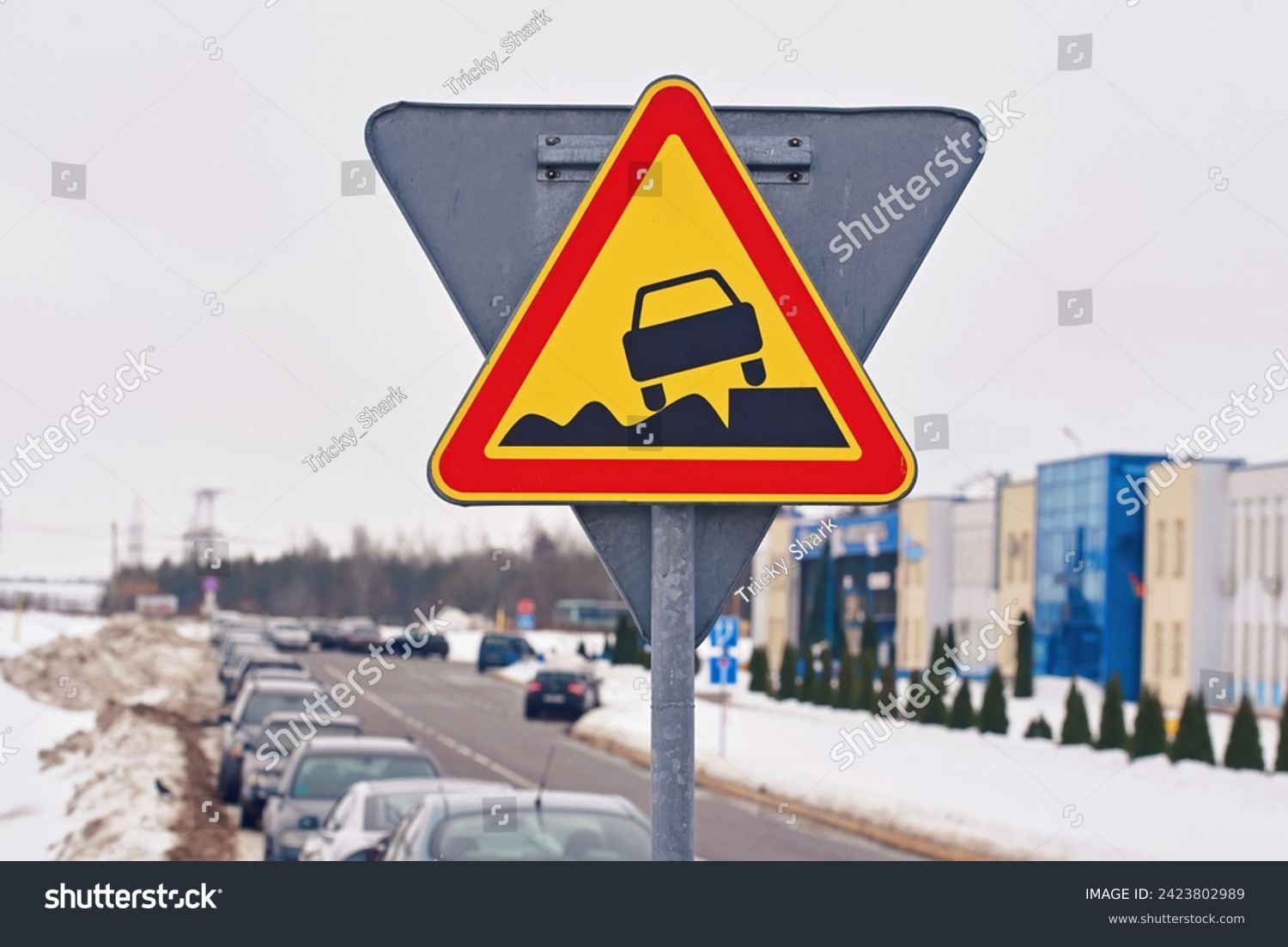 Soft verges, Warning sign, traffic sign and cars parked in row along dangerous snowy roadside on background. Soft verge road sign, car parked with traffic violation. Dangerous parking on soft roadside #2423802989