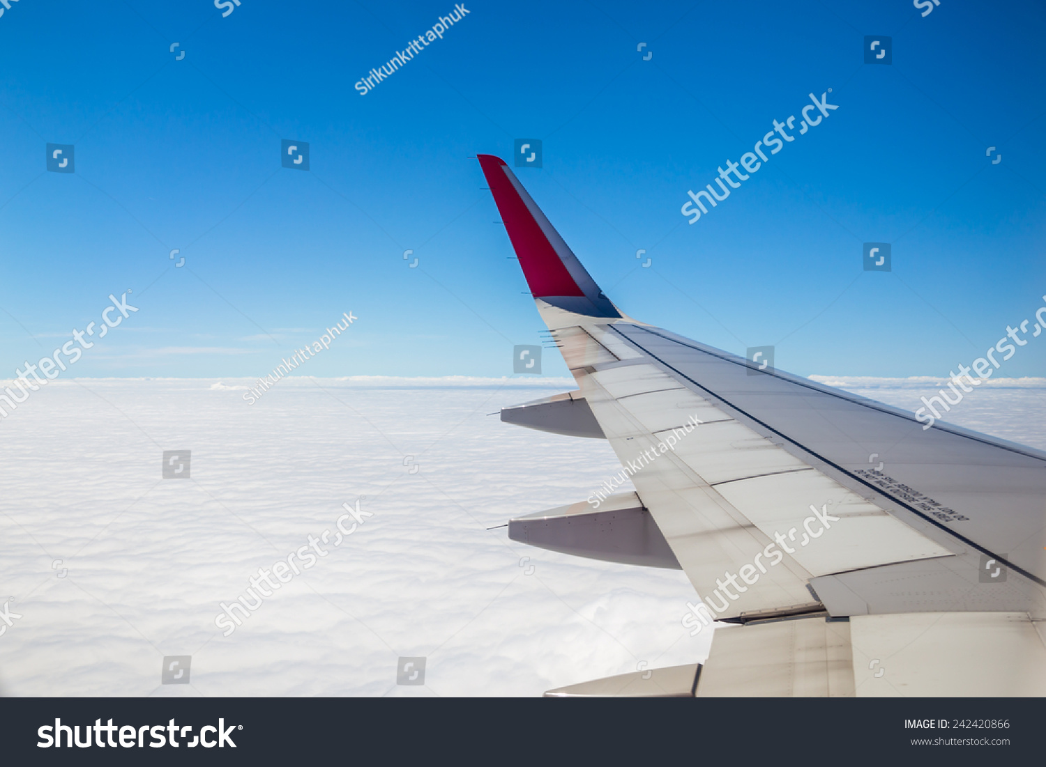 Aircraft wing on the clouds,flying background #242420866