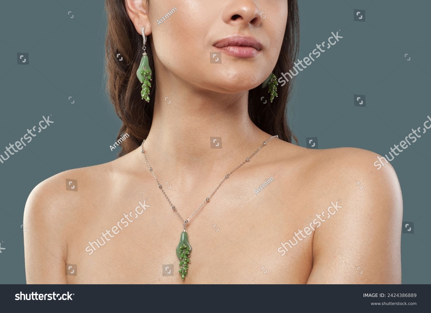 Green aventurine or chrysoprase jewelry model. Woman with bijou close up #2424386889