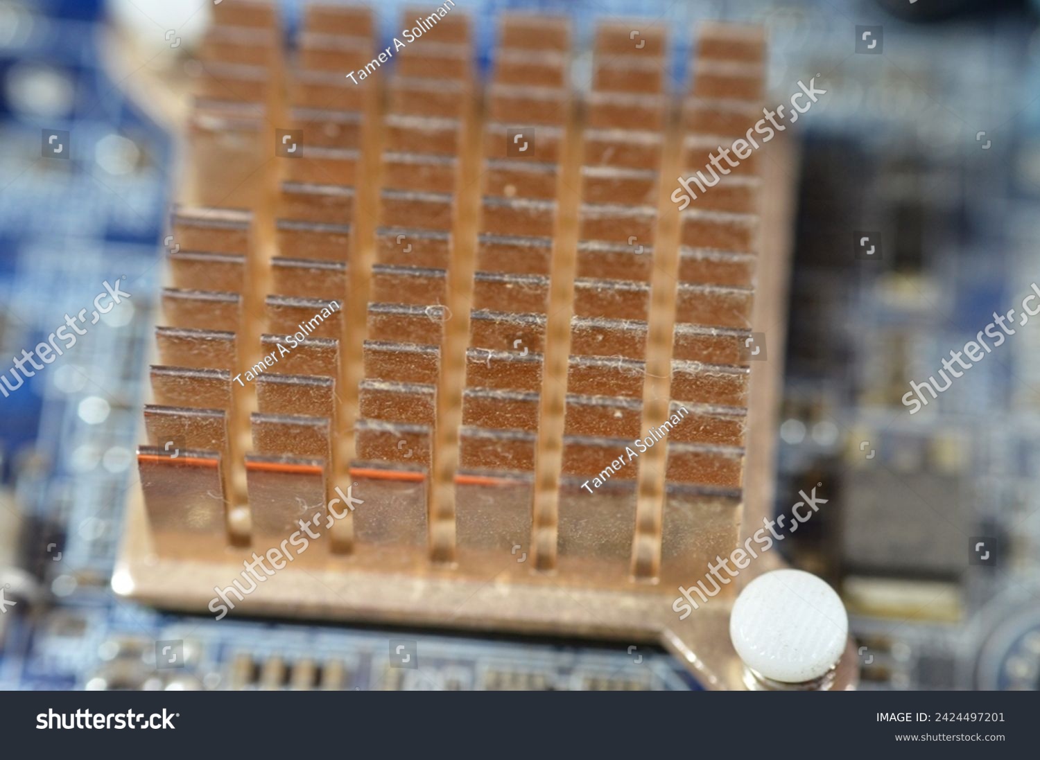 A closeup of a computer main board electronic motherboard, the main printed circuit board (PCB) in general-purpose computers and other expandable systems, allows communication of electronic components #2424497201