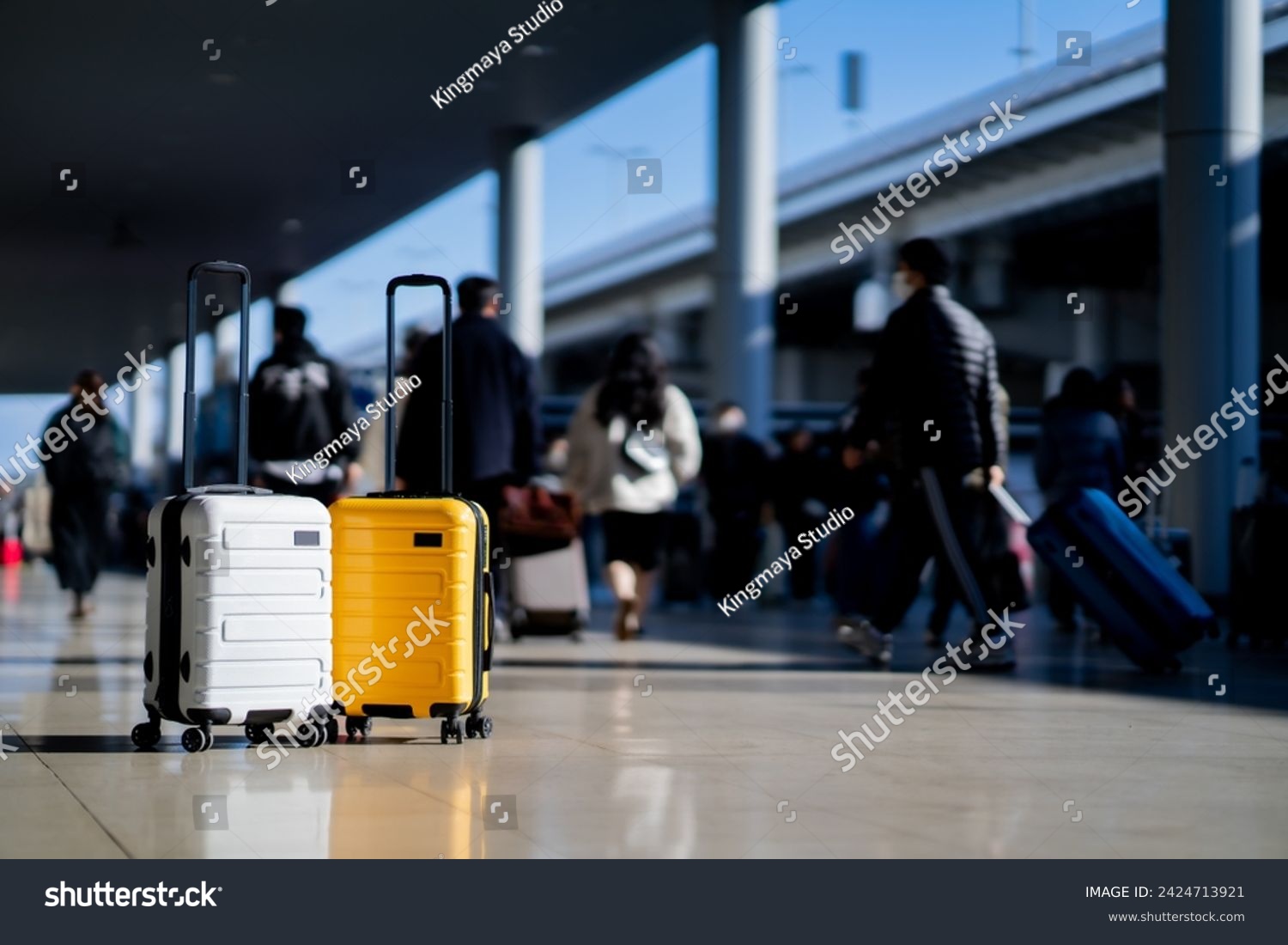 Travel, Two suitcases in an empty airport hall, traveler cases in the departure airport terminal waiting for the area, vacation concept, blank space for text message or design #2424713921
