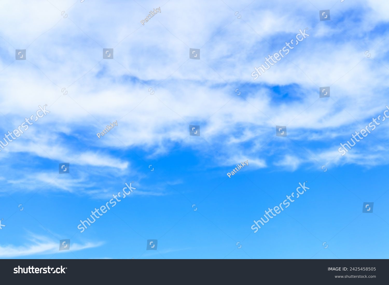 Blue sky background with white clouds, similar to fog covering mountains and waves in the sea. #2425458505