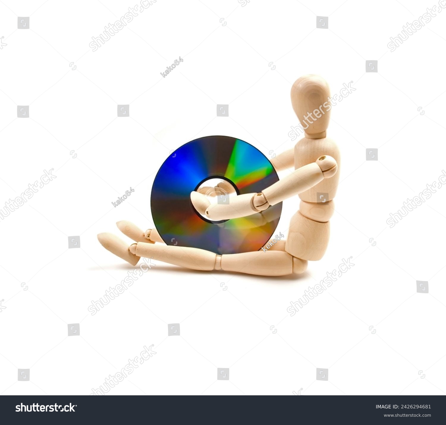 wood mannequin with CD-rom on white background #2426294681