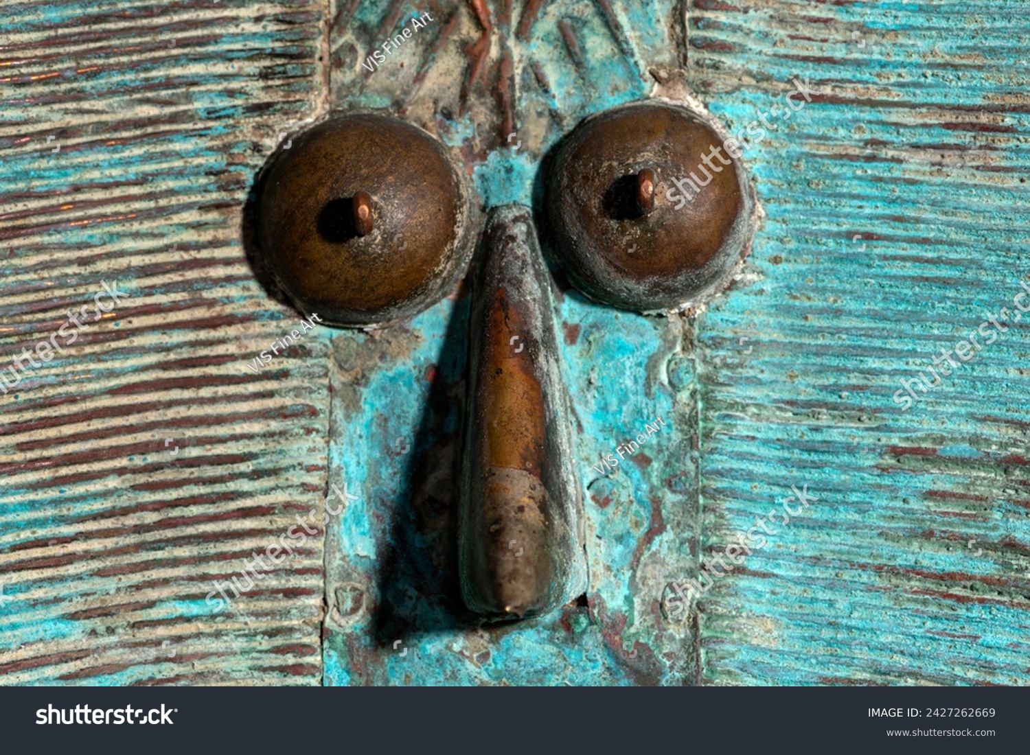 Macro shot of a wooden Kota reliquary figure from Gabon. Tribal African art, showcasing masterful craftsmanship and spiritual symbolism. #2427262669