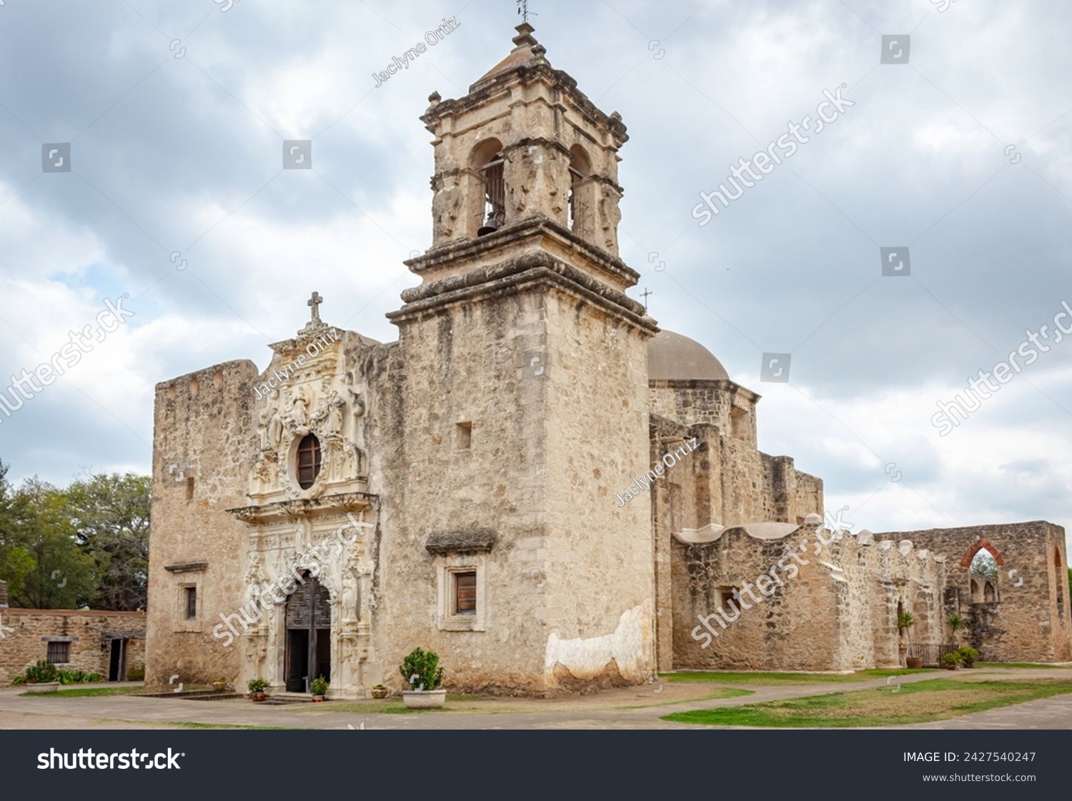 Traditional brick architecture of the old Mission San Jose located at the San Antonio Mission Historical park in San Antonio Texas. Picture is taken on a cloudy overcast day #2427540247