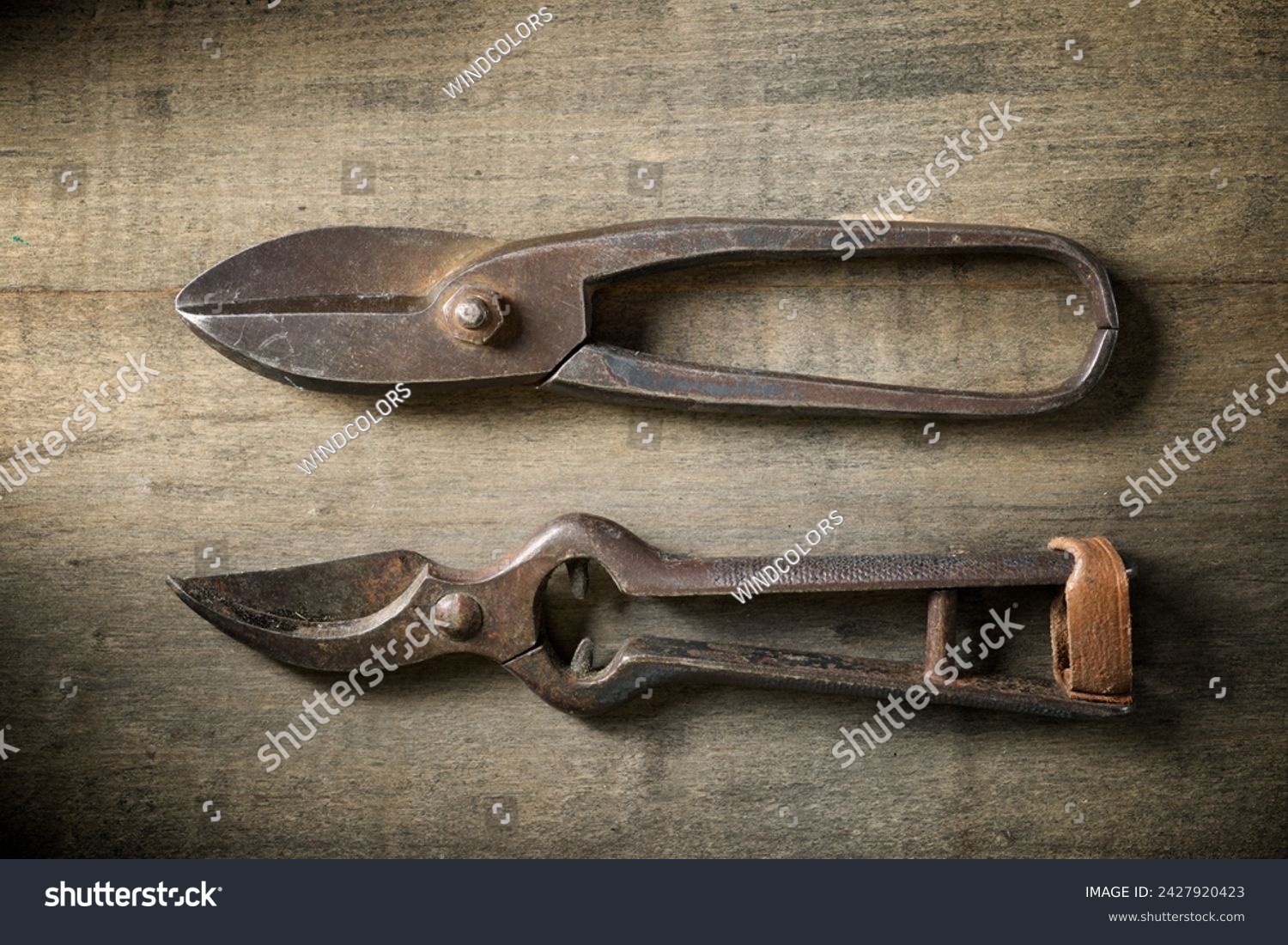 Close up of a pair of old disused pliers on a work bench. #2427920423