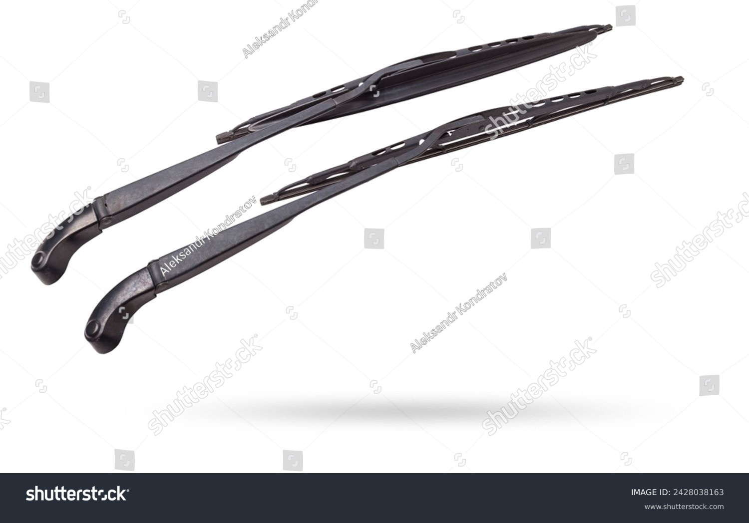 A pair of black plastic wipers on a white isolated background with rubber brushes for cleaning from dirt, dust or rain without hampering the driver's visibility. Spare part for the car at the parsing. #2428038163
