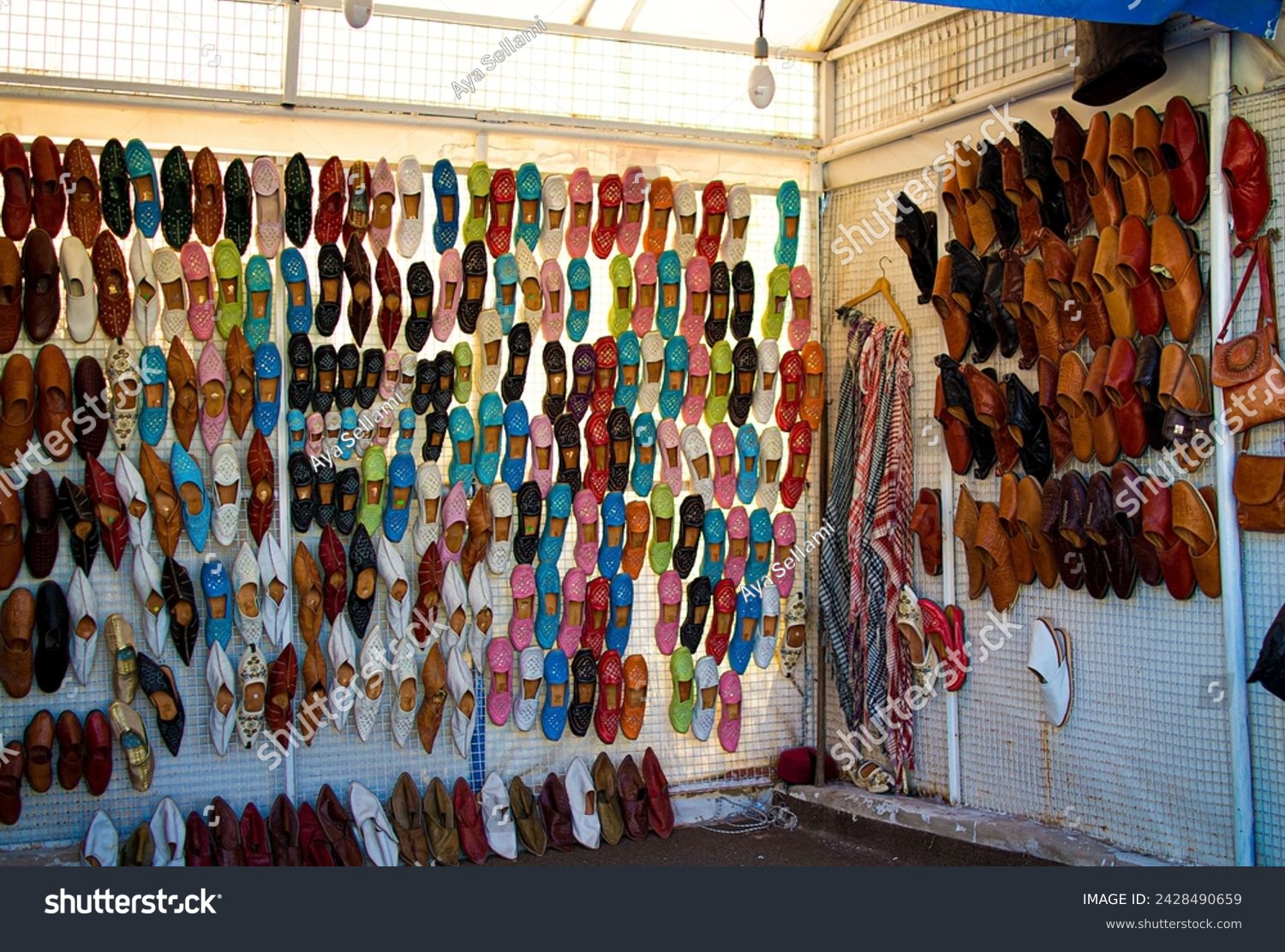 Handcrafted traditional shoes sold in a souvenir shop in the village of Sidi Bou Said, Tunisia near the capital of Tunis (a UNESCO world heritage site) #2428490659