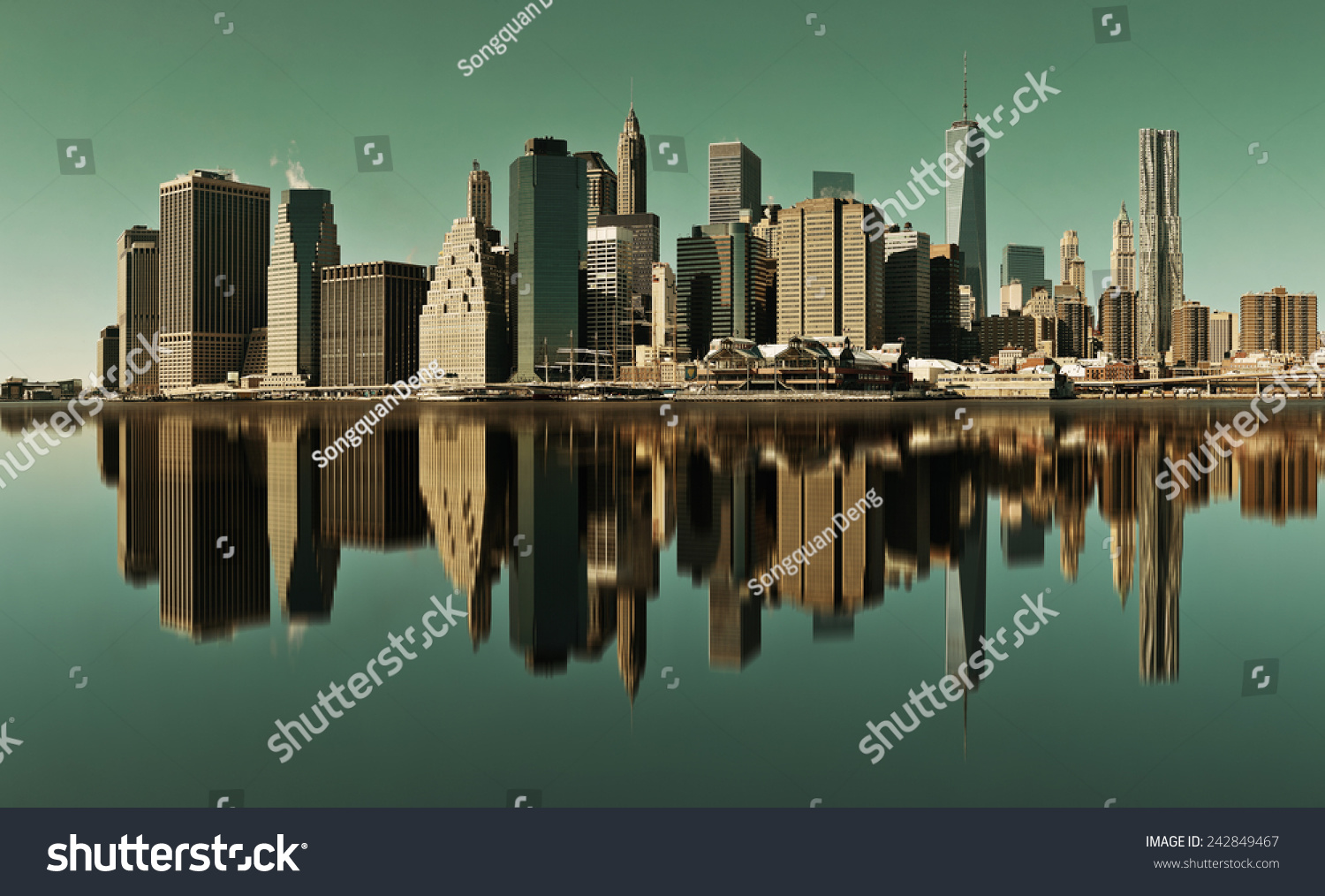 Manhattan financial district with skyscrapers over East River with reflection. #242849467