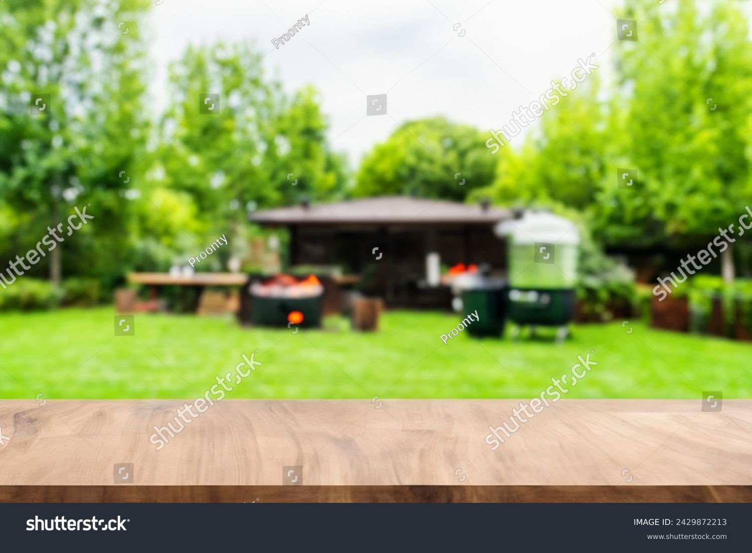 summer concept with wood table top backyard garden with grill BBQ, wooden table, blurred background,  #2429872213