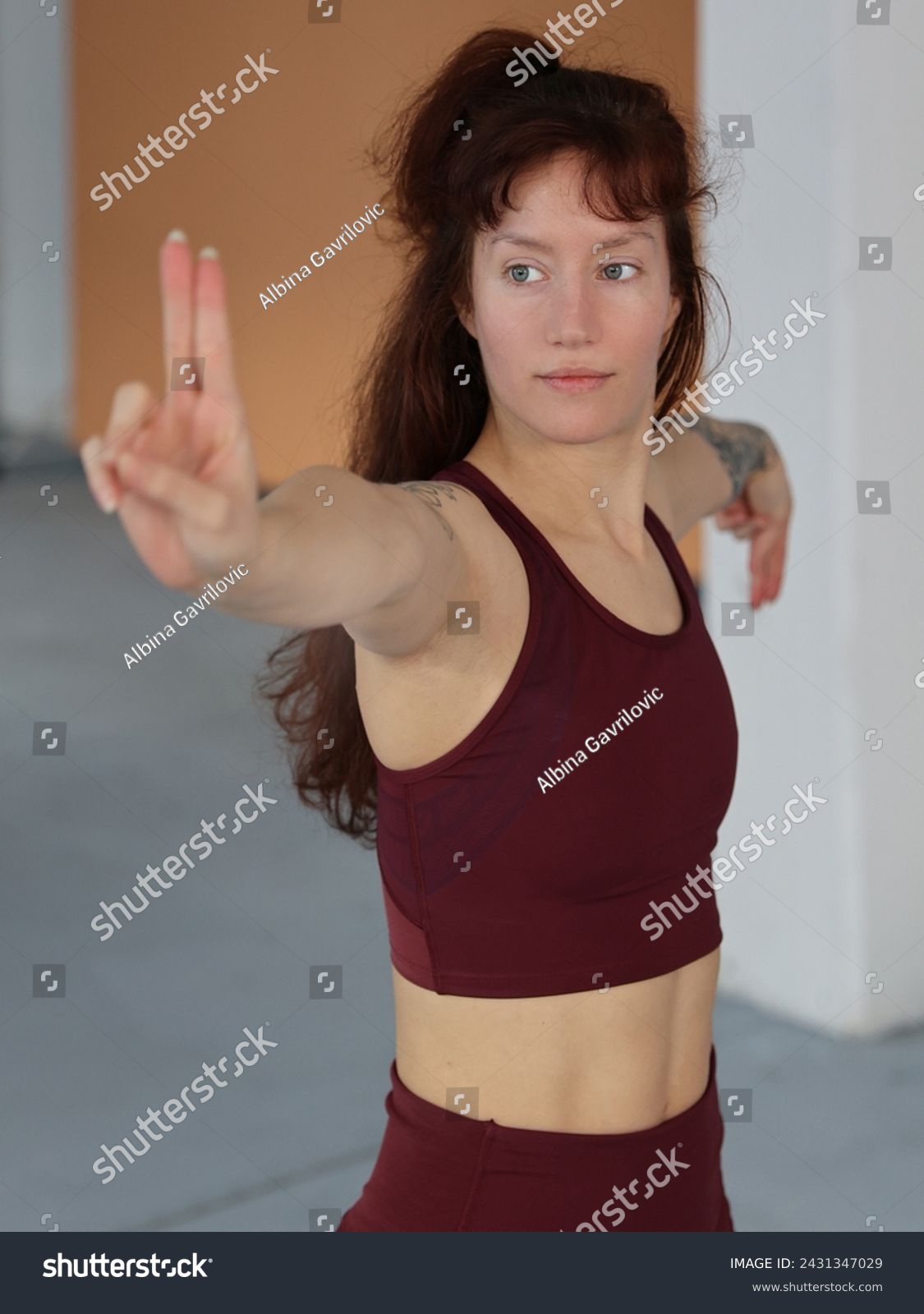 Beautiful woman practicing Yoga, or Tai Chi, Tai Ji Chuan, and Qi gong. Sport muscular body, prefect stomach abs muscles #2431347029