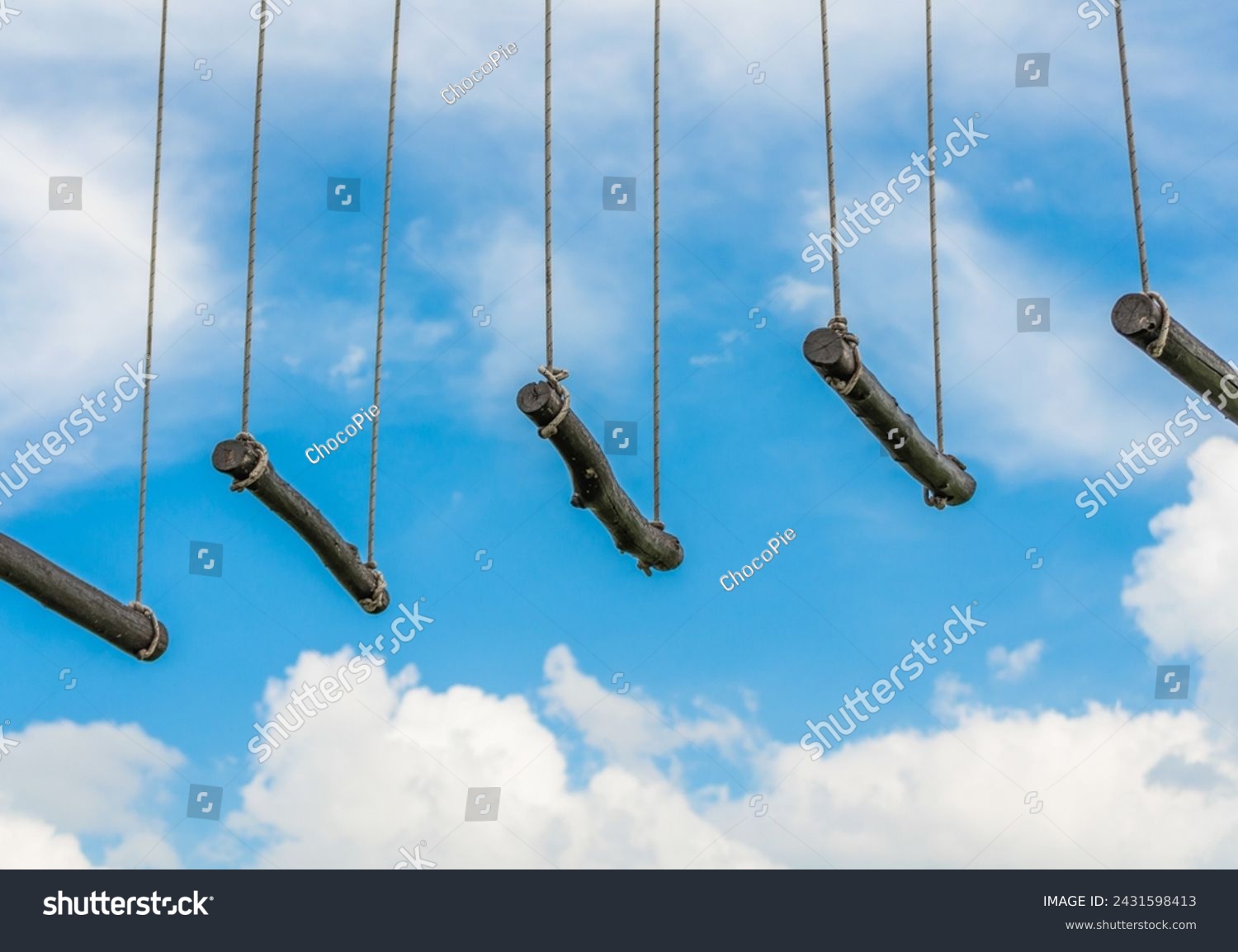 rope ladder against a blue sky and clouds #2431598413