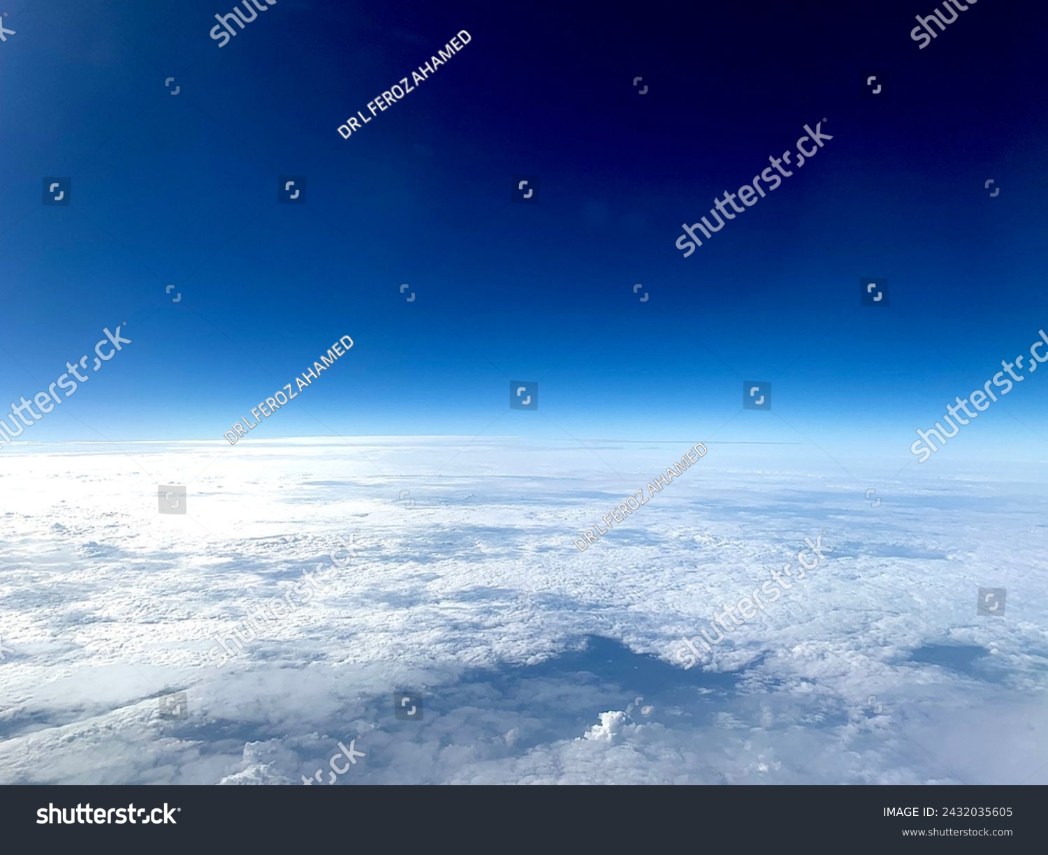 Image from flight seeing blue sky above clouds #2432035605