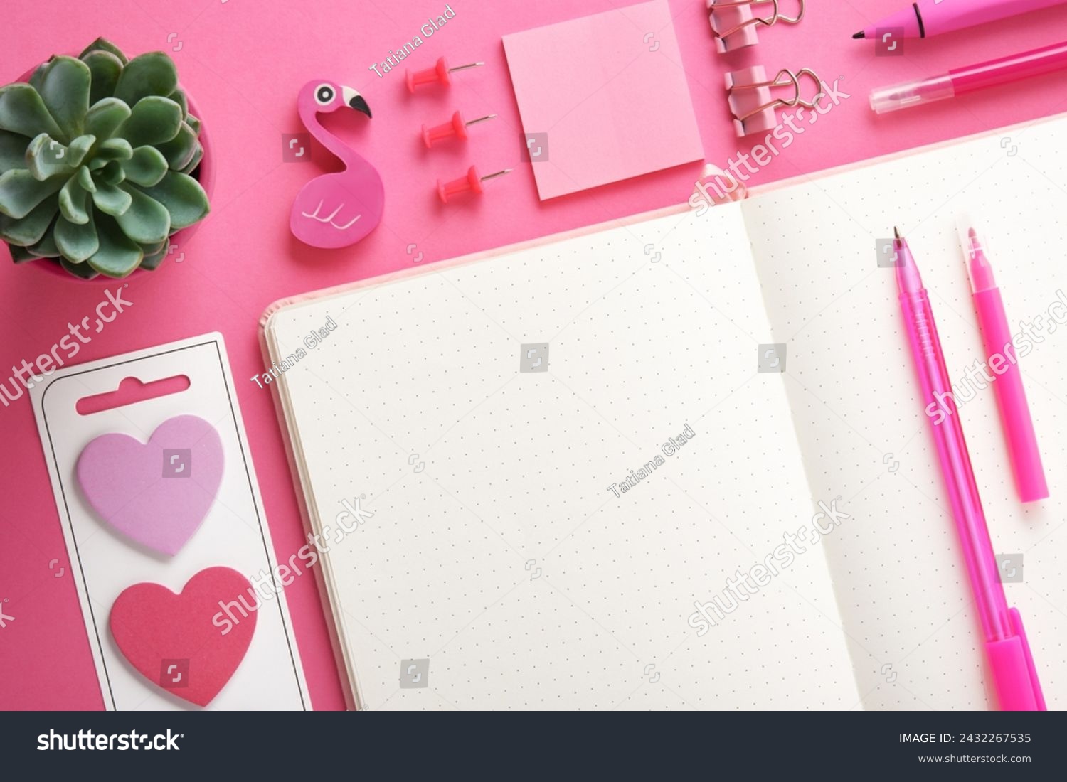 Blank notebook page for your text with pink school and office stationery on magenta background. Flatly. #2432267535
