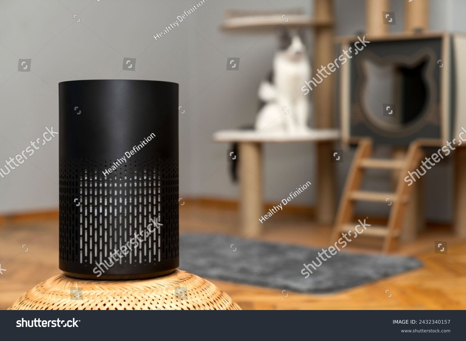 air purifier in the area with pets or cat. Air Pollution Concept. Air purifier, filters out invisible viruses, allergens or pollutants in the house on a cat tree background. Cute cat and Air purifier #2432340157