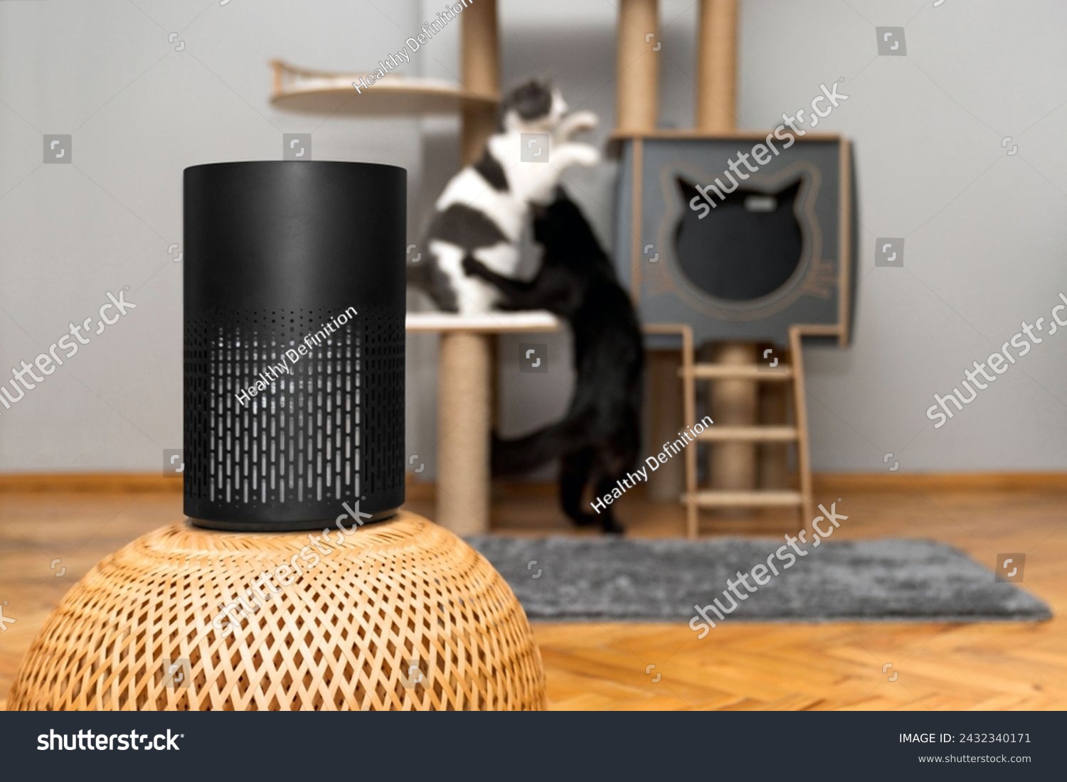 air purifier in the area with pets or cat. Air Pollution Concept. Air purifier, filters out invisible viruses, allergens or pollutants in the house on a cat tree background. Cute cat and Air purifier #2432340171