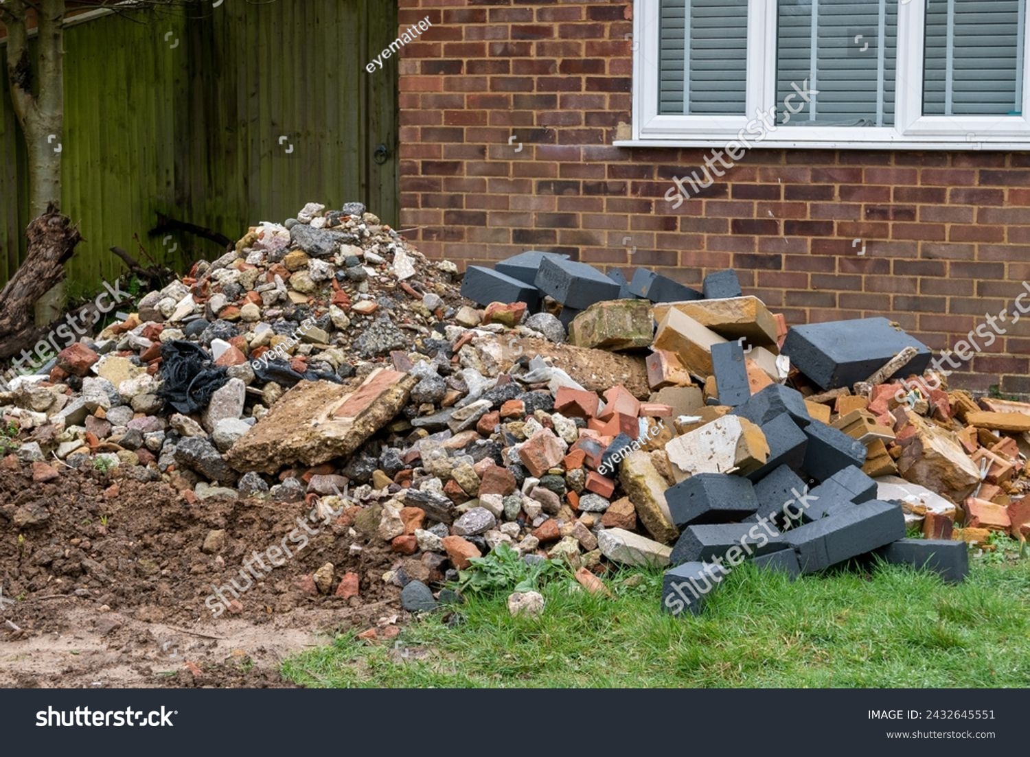 Building rubble in a suburban front garden during a home renovation #2432645551