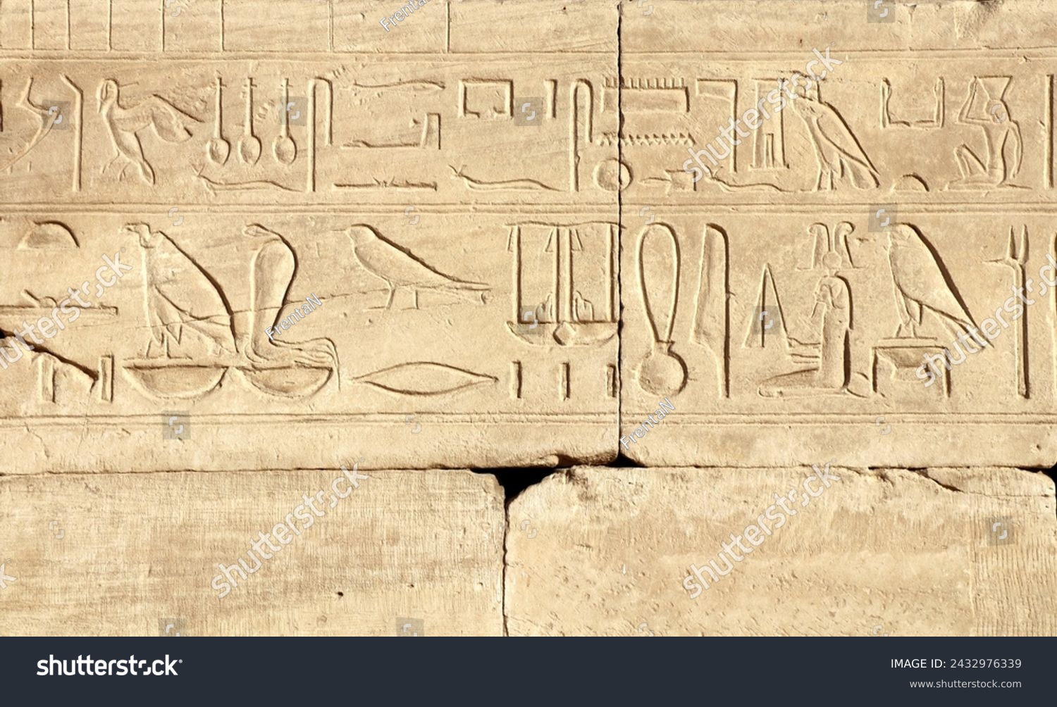 Ancient Egyptian hieroglyphs on stone wall, Karnak Temple Complex, Luxor, Egypt, Africa. Stone carvings with hieroglyphs at Karnak temple, Luxor, Thebes #2432976339